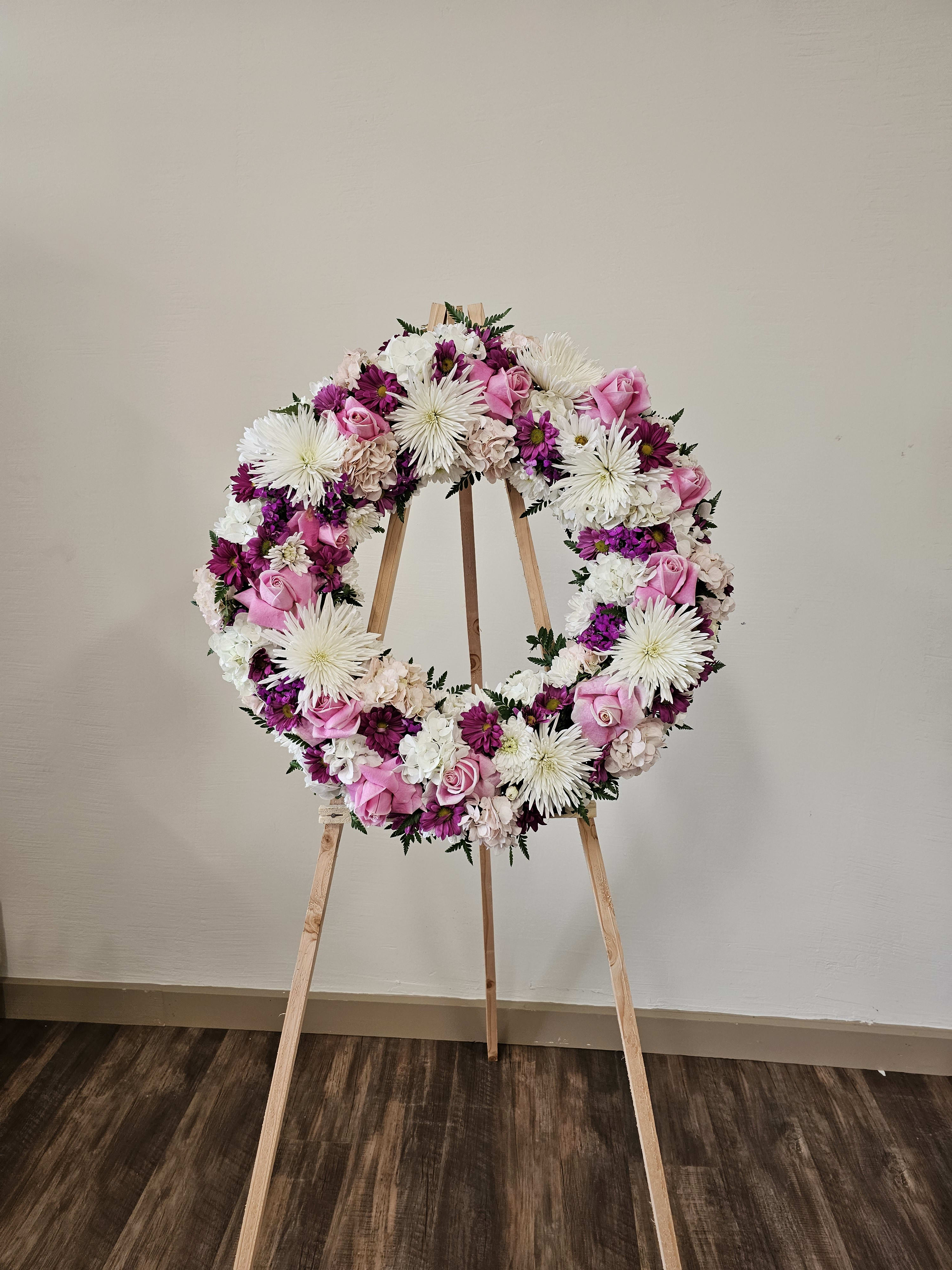 Always Remember  - Our standing wreath in  pink white and lavender flowers. Is a lovely way to celebrate those moments is a beautiful way to honor their Life.