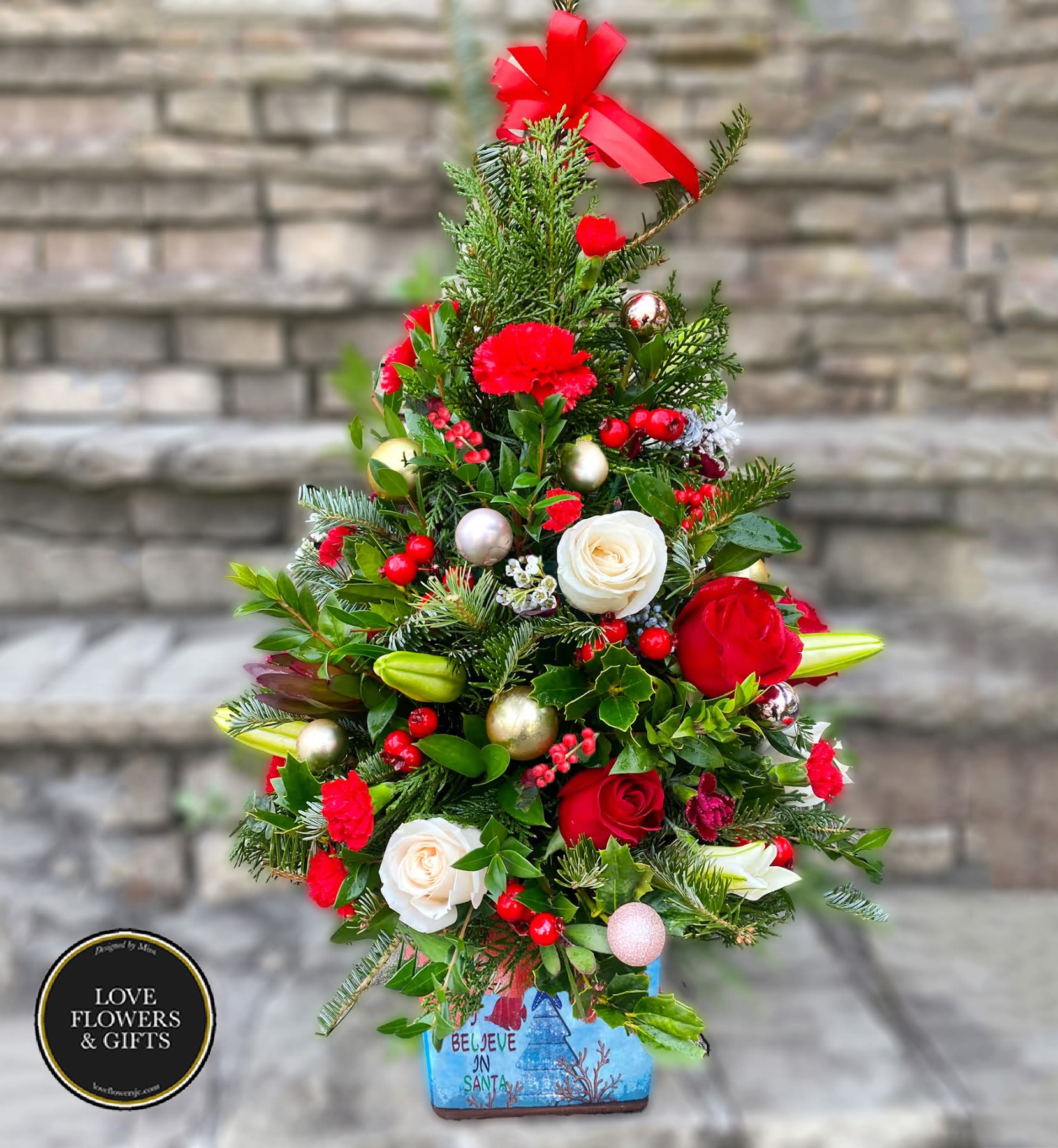 Santa's Tree  - Designed in high-quality holiday ceramic pot, a tall beautiful tree to fulfill all your loved ones' wishes.   Measures appx 25&quot; tall 