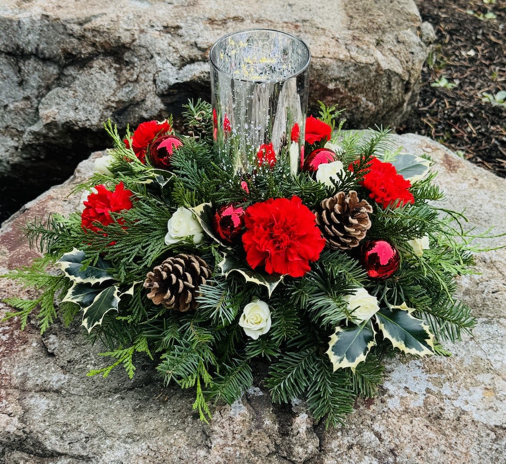 Christmas lights - This is a Christmas centerpiece with hurricane that includes fairy lights that make is sparkle and twinkle with delight.  Lush with greens and lovely flowers 