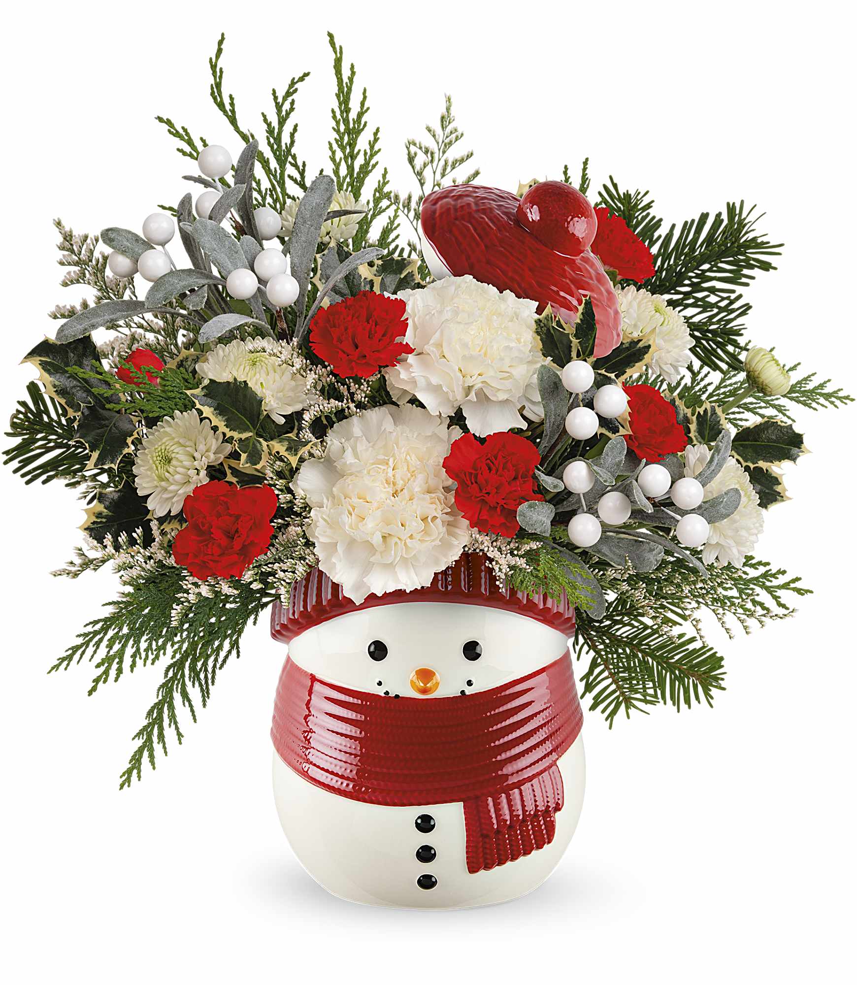 Snowy Delight Bouquet - Charming and festive, this classic Christmas gift presents a delightful ceramic snowman treat jar filled with joyful holiday blooms, adding a touch of seasonal magic to any space. Celebrate the holiday season with this festive arrangement of white carnations, miniature red carnations, and white button spray chrysanthemums, adorned with variegated holly, noble fir, and cedar. Teleflora's Snowy Delight Bouquet is beautifully delivered in Teleflora's Frosty Wishes Jar, adding a touch of winter charm to any setting. Approximately 11 3/4&quot; W x 12 1/4&quot; H
