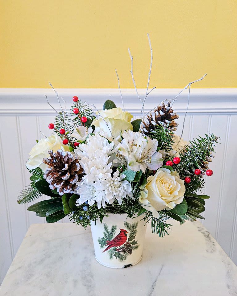 Frosted Enchantment - This arrangement is designed to bring a touch of winter magic to your home. Perfect for holiday celebrations or as a stunning gift, its elegance and charm will captivate anyone who sees it. approx 11 in X 11 in