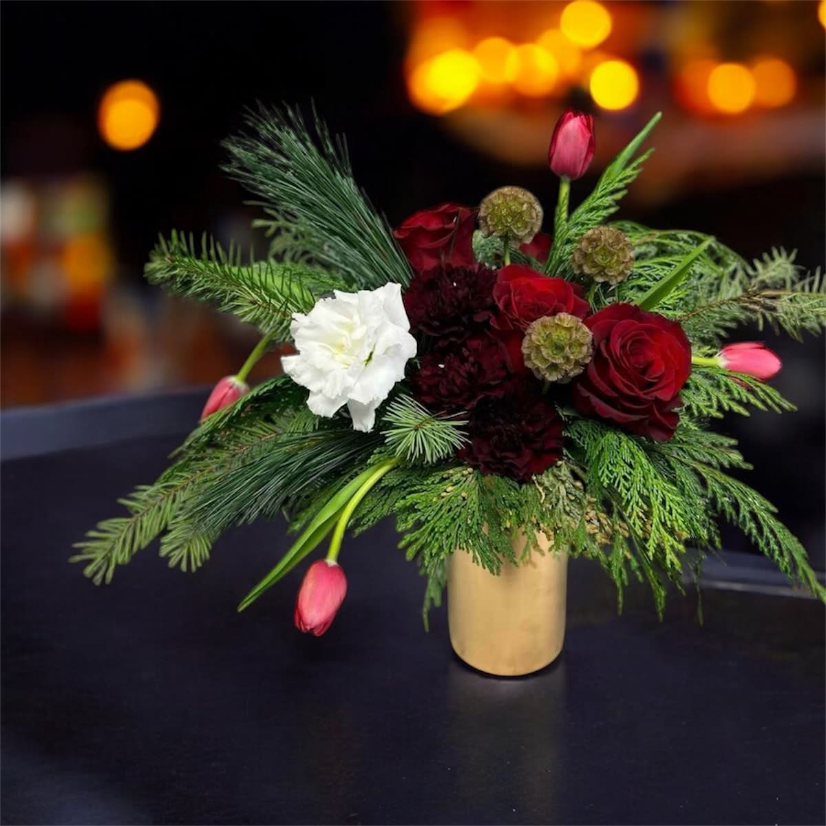 Pine-ñata  - There is no candy hidden inside of the Pine-ñata, but it will make you feel sweet inside all the same. Seriously, don’t destroy this arrangement looking for candy. Purchase candy at the store, you’re a grown adult. Instead, use this Pine-ñata masterpiece to sweeten that special someone’s day with the soothing smells of pine and roses. 