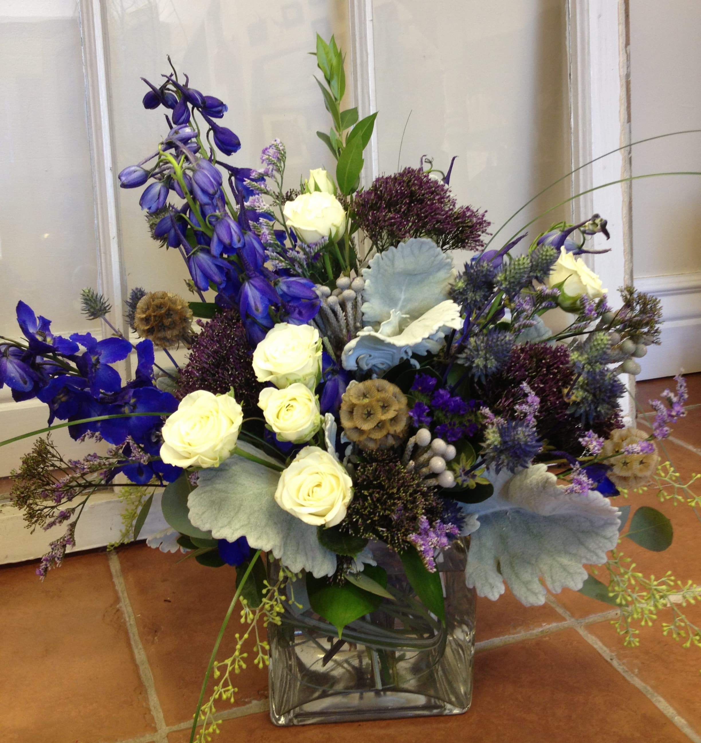 Study in Blue - Earthy textures combine with a blue, white and gray color scheme for a monochromatic design in a 5" clear glass cube. 
