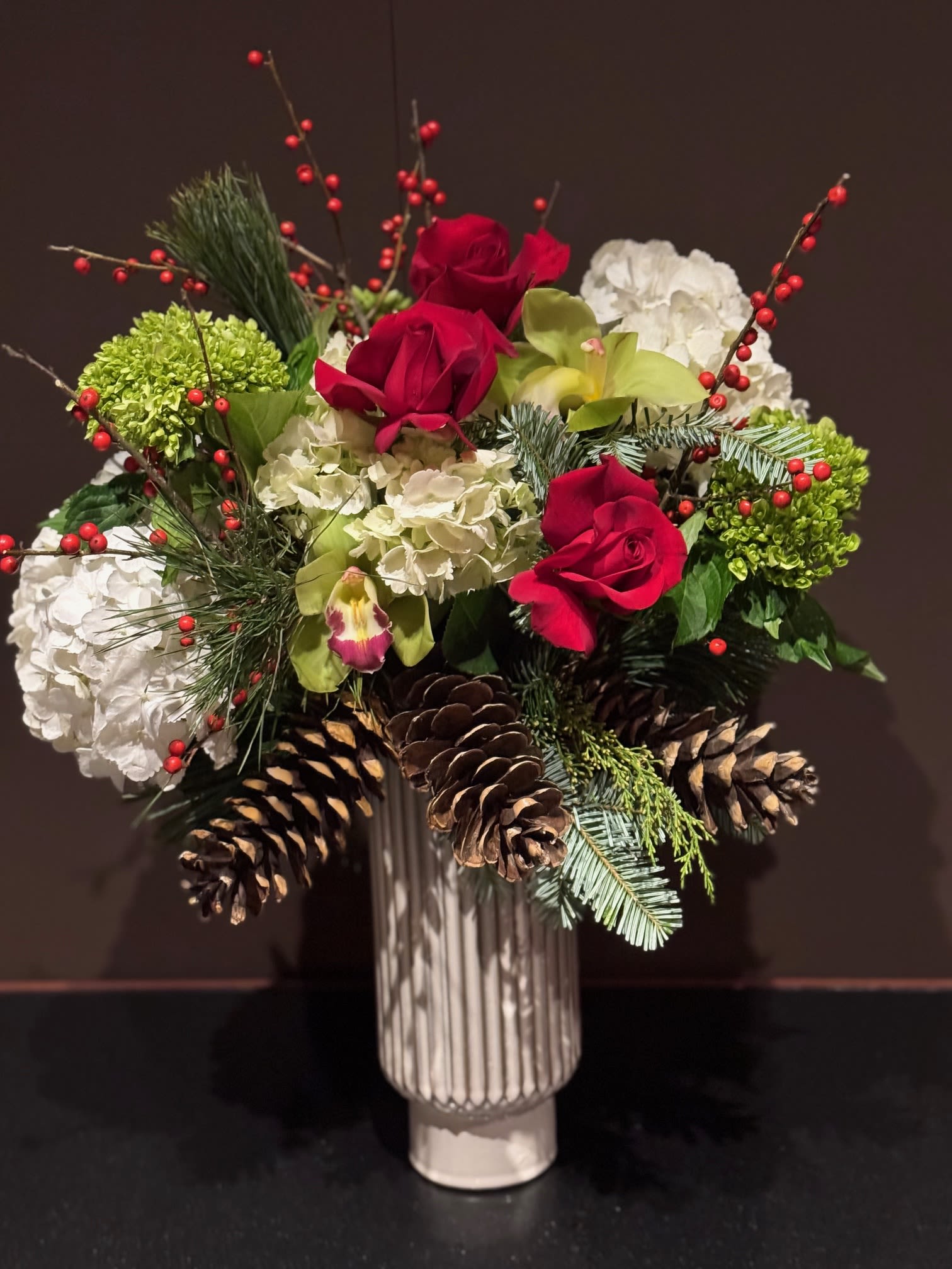 Tall Holiday - A full and festive arrangement of red, green, and white blooms. 