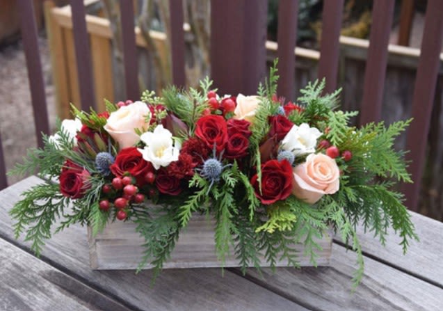 Chic Christmas Box - Bring the spirit of the holiday season indoors with this beautiful arrangement. The beautiful mixture of holiday blooms and green creates a simply stunning mix. Add a touch of the outdoors to your holiday table with the Chic Christmas Box!