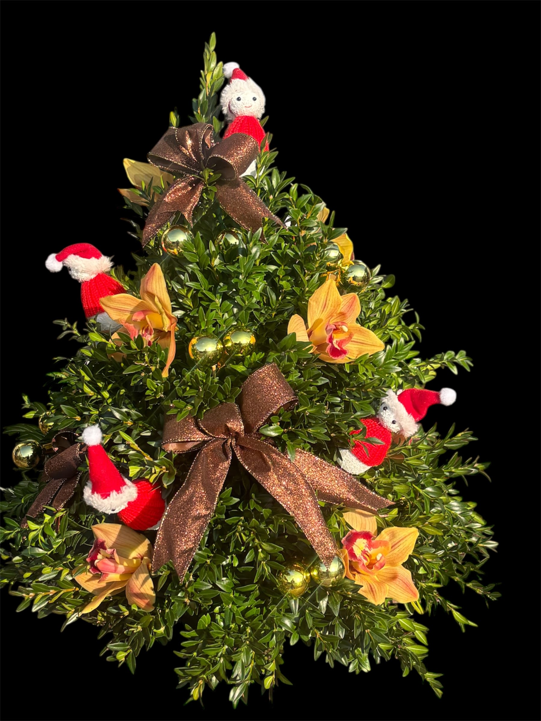 Bergeron's Luxe Christmas Tree - A festive centerpiece featuring golden cymbidium blooms, cheerful Christmas snowmen, elegant brown ribbons, and shimmering gold ornaments. This luxurious design blends warmth and sparkle, bringing holiday magic to any space.