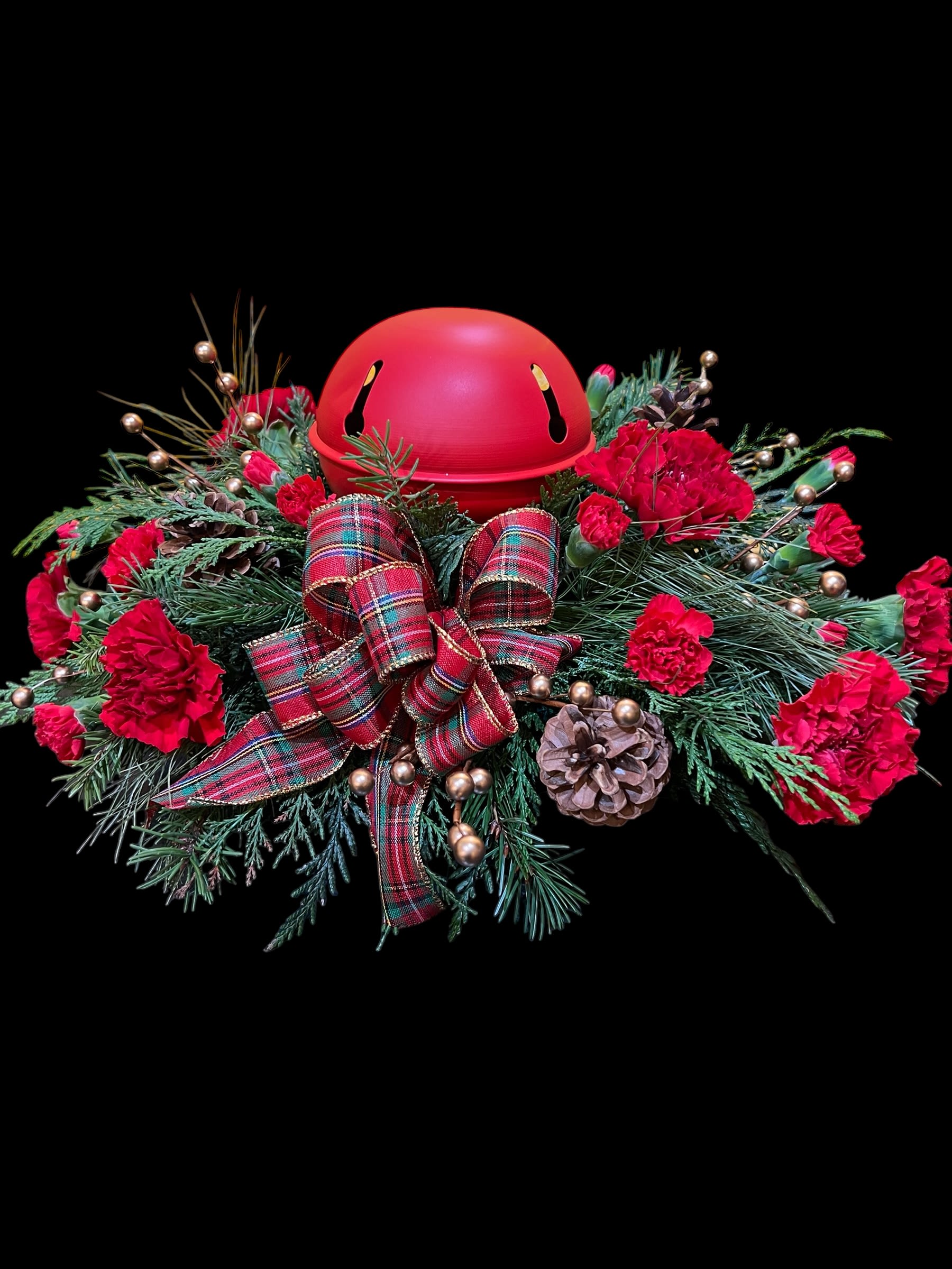 Jingle all the Way Centerpiece - Winter greens, red carnations, country plaid ribbons,  and holiday decorations topped with a sleigh bell. Our own design!