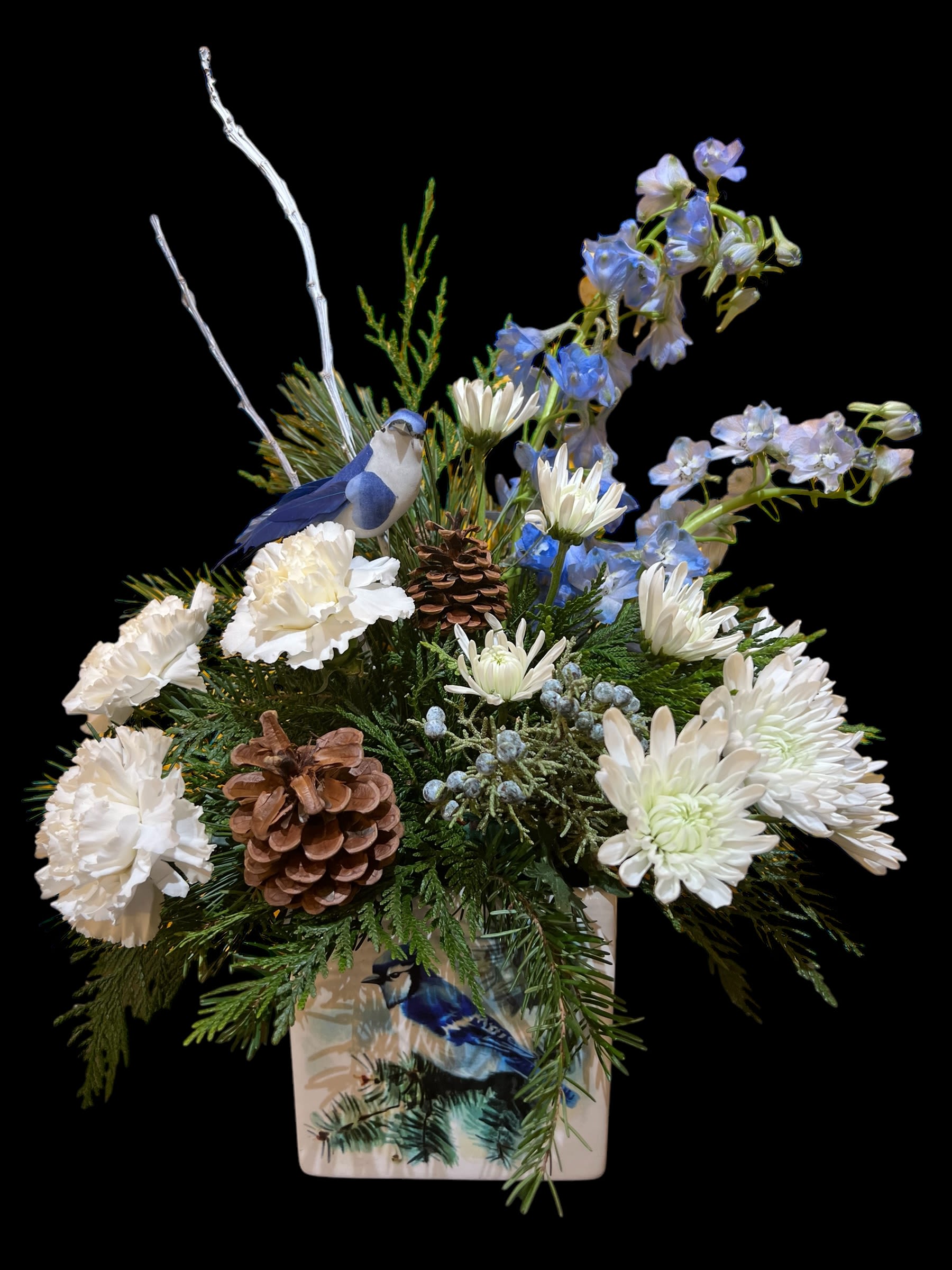 Blue Jay Winter Arrangement - A winter feel - our own design... includes white flowers, blue delphinium and a blue jay.
