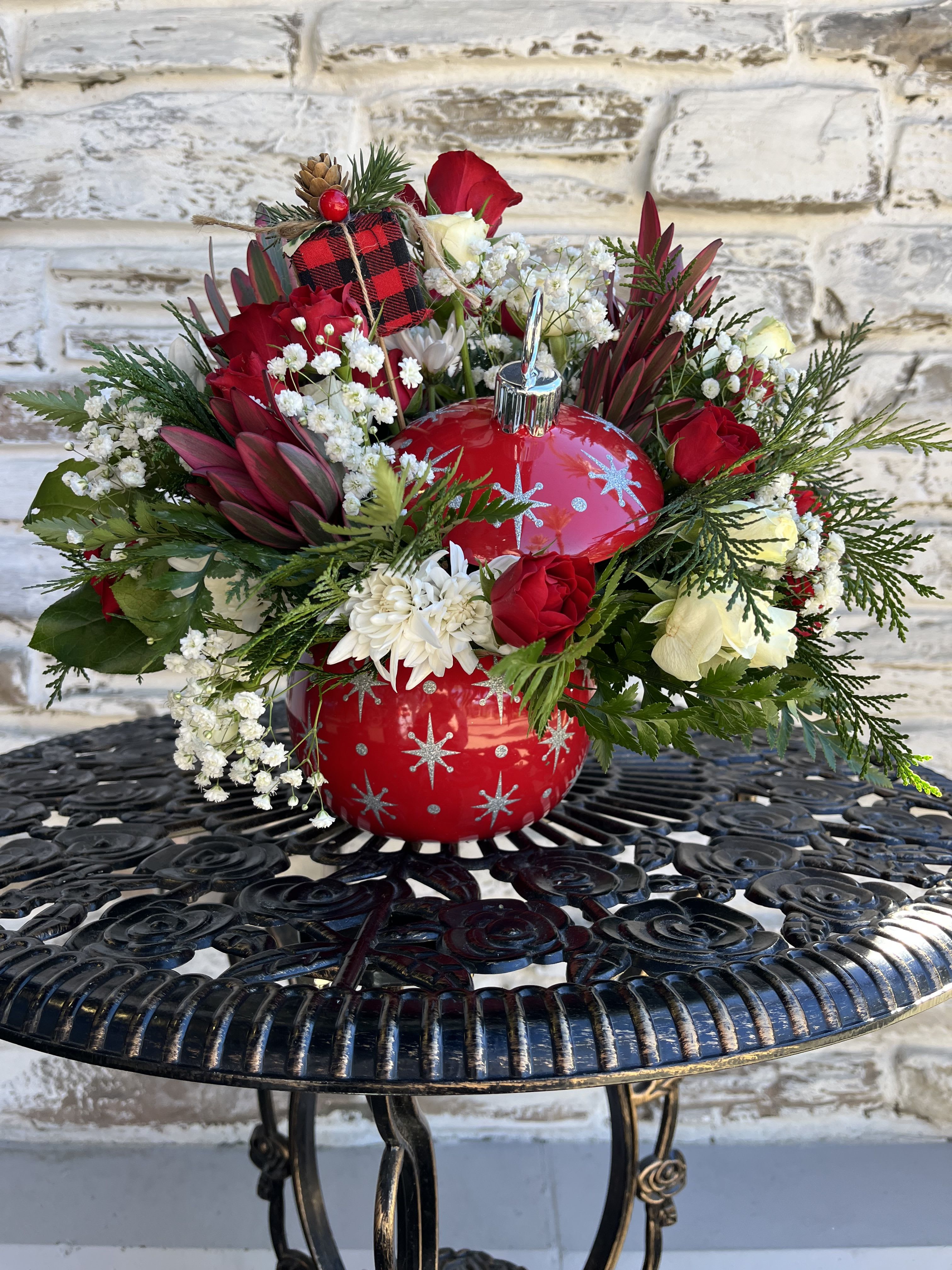 Red Twinkling Ornament - Make Christmas twinkle with mixed holiday blooms arranged in a festive, hand-painted, ceramic ornament jar with sparkling stars. Later, it's perfect for wrapped candies and other holiday items!