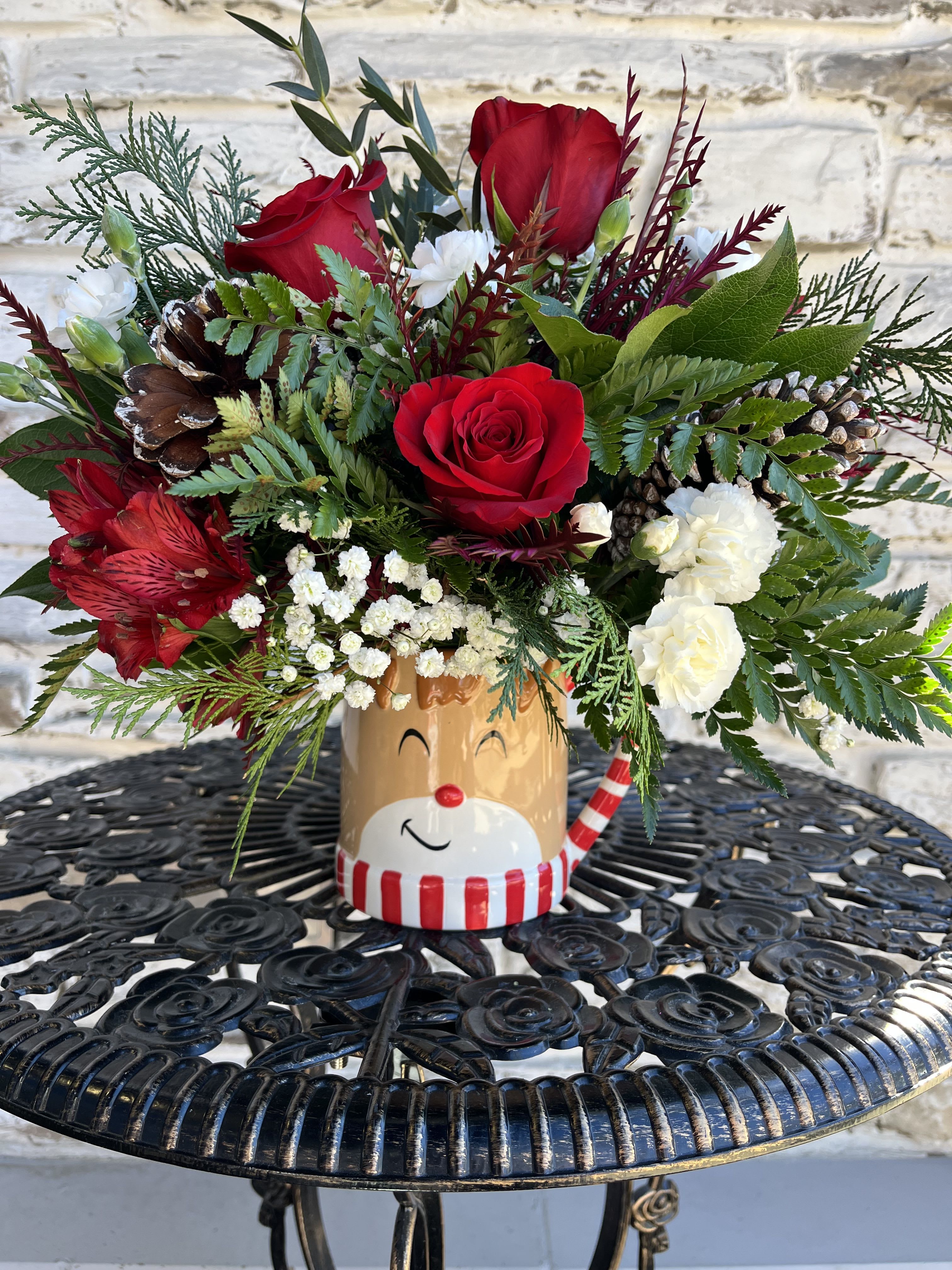 Reindeer Wishes - Overflowing with festive blooms, this adorable reindeer delivers your holiday wishes! The glazed, ceramic mug adds a whimsical touch to your seasonal sipping.