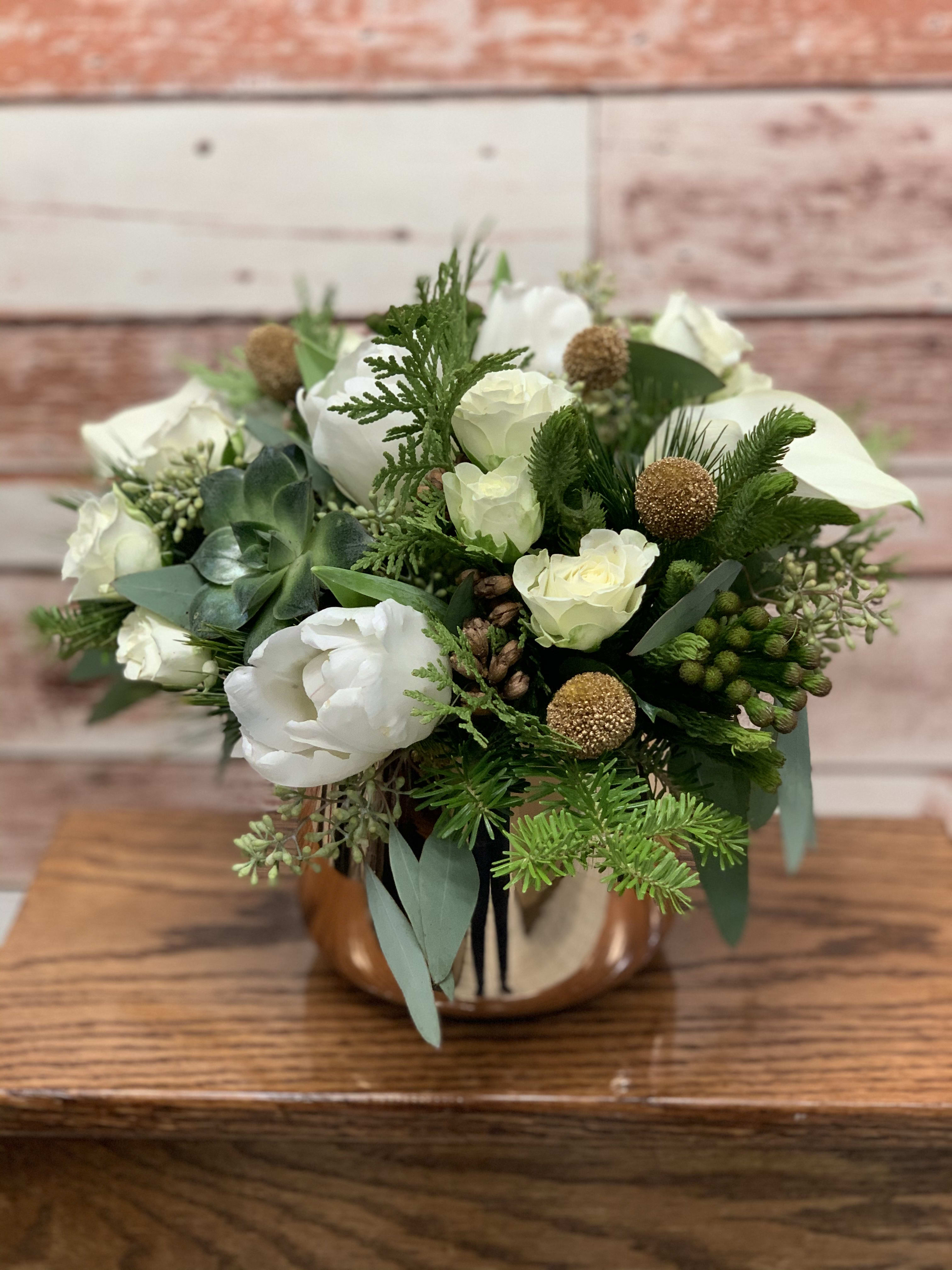 Golden New Year  - A delicate white arrangement in a golden vase with gold gold and succulent accents. A perfect arrangement for bringing in the New Year and reflecting on the good times with loved ones. 