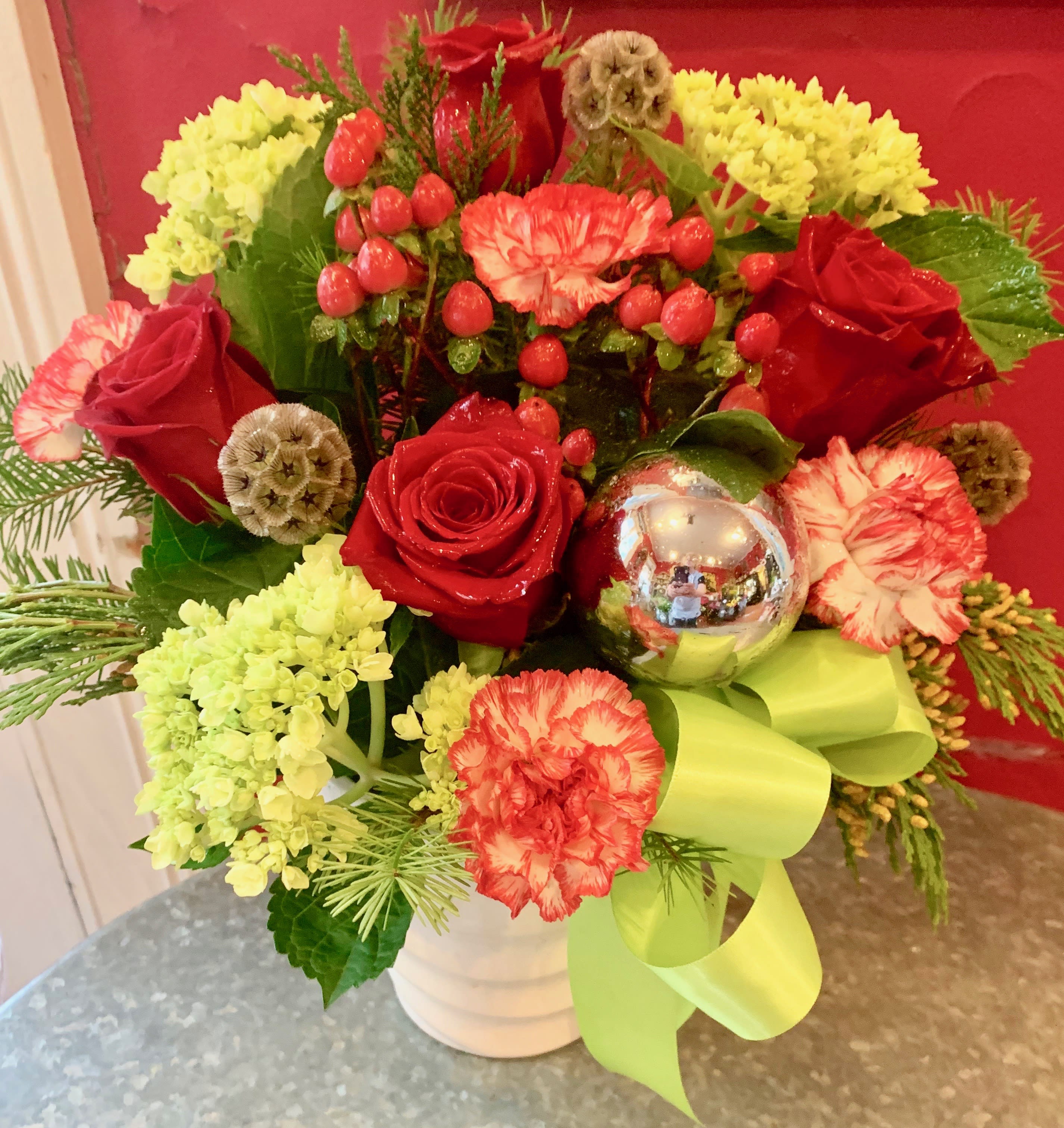 Holiday Cheer - Roses, X-mas greens, hydrangeas and peppermint carnations make up this cute design.