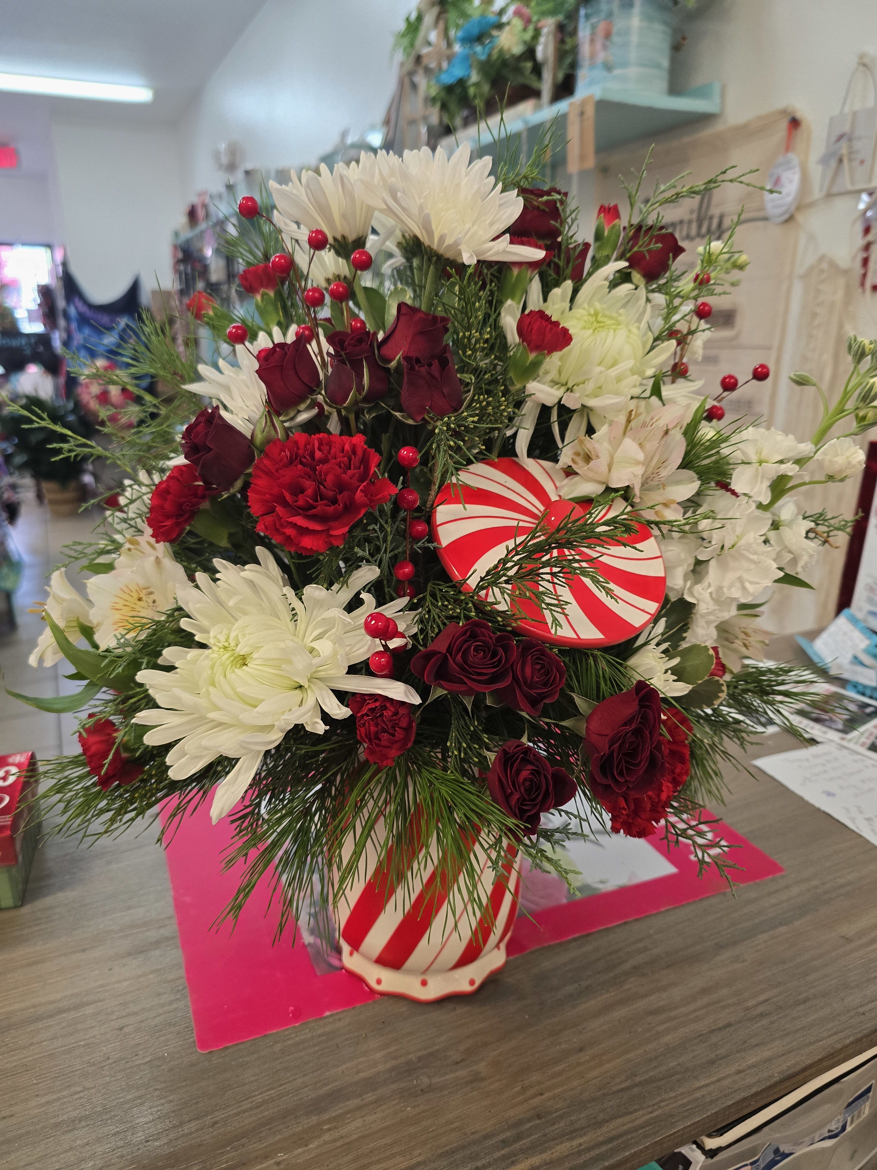 Christmas arrangement in a keepsake  - We get to choose the keepsake whatever price you go with is what container we will use.