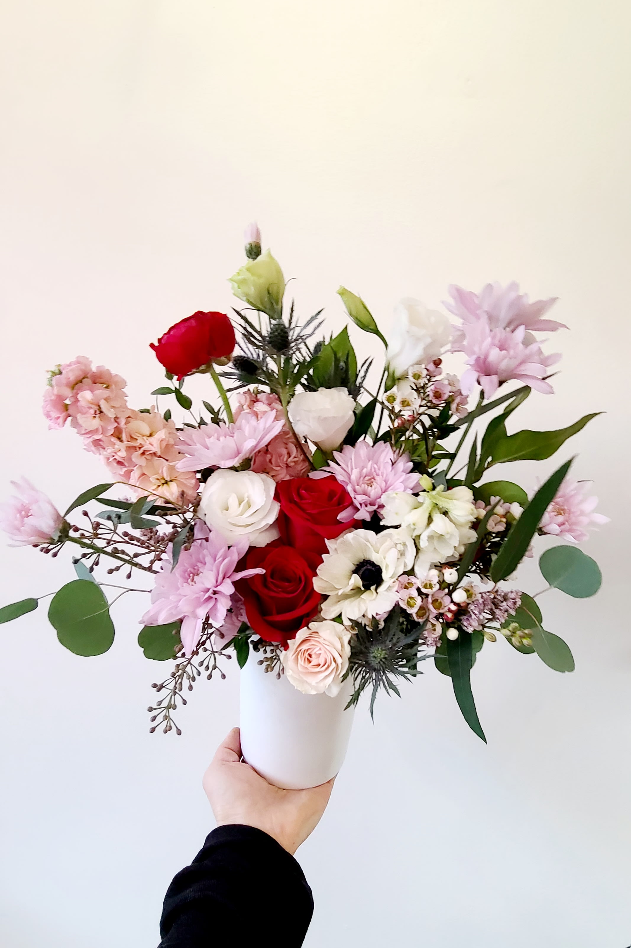 Winter Romance (Medium Tall) - Medium Tall Vase Arrangement   *Store Hours: Mon~ Fri: 10:00 a.m. to 6:00 p.m. Sat: 9:00 a.m. to 4:00 p.m. Sun: Closed  *Delivery: Deliveries occur roughly between 9am - 5pm. We are unable to offer further specific delivery windows or guarantee delivery times. but we will always do our best to accommodate requests. If your delivery address has a gate code number, please provide it for smooth delivery.  *PICK UP: Pick up is available after 10am. If you need to pick up before 10am, please contact our shop to place your order directly. Text order: (714)715-1482  Please note that your arrangement may vary slightly from the picture depending on the season and store stock, but we will match color schemes and guarantee it will be fresh &amp; beautiful.  Thank you!