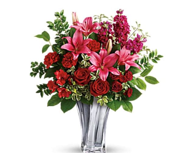 Sterling Love Bouquet - &quot;Sleek and chic, this sterling silver mirrored, blown glass vase adds a touch of modern luxury to this gorgeous bouquet of red roses and pink lilies. Red roses, dark red spray roses, dark pink asiatic lilies, red alstroemeria, and burgundy stock are arranged with lemon leaf, huckleberry, and pitta negra. Delivered in a Sterling Love Vase.   Orientation : All-Around  All prices in USD ($)  Standard  T19V200A  Deluxe  T19V200B  Premium  T19V200C&quot;
