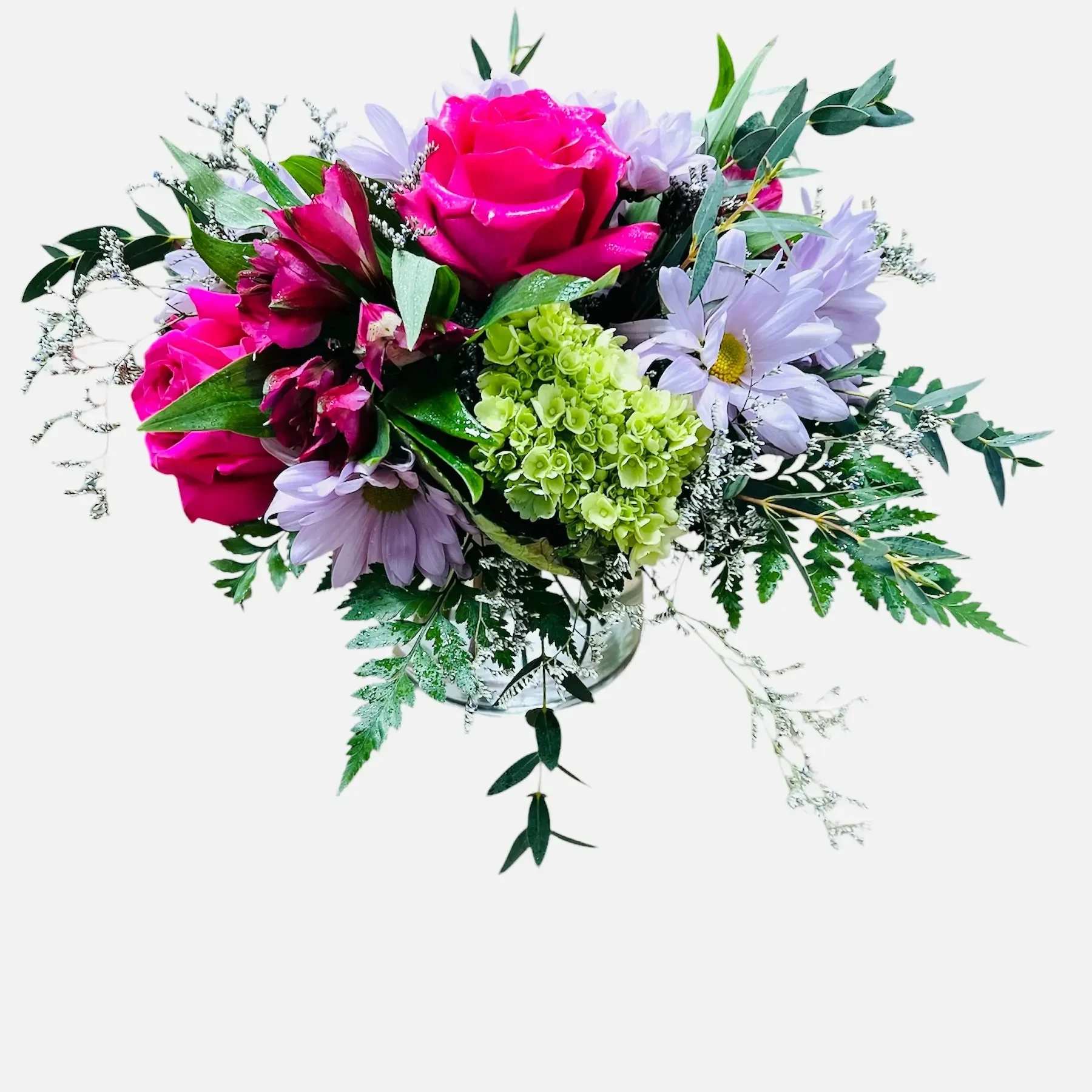 Stems Cylinder Vase - Three roses nestled in foliage, daisy chrysanthemum, alstroemeria, spider chrysanthemum, caspia, hydrangea, and eucalyptus.