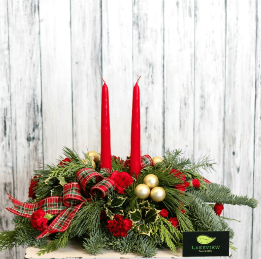 Tartan - Classic Christmas plaid is the finishing touch to a traditional centerpiece of evergreens, holly and long-lasting carnations.  Approximately 13&quot; Tall X 17&quot; Wide 