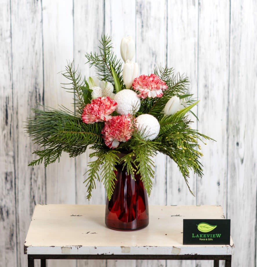 Cozy - Perfect for a kitchen table, desk or windowsill, this petite holiday arrangement features peppermint carnations, alstroemeria and tulips.  Approximately 15&quot; High x 11&quot; Wide