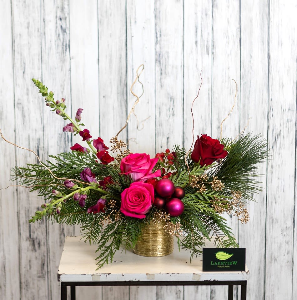 Sugarplum - Visions of sugarplums are dancing by in this elegant seasonal centerpiece of reds, magentas and purples.  A true holiday statement arrangement.  Approximately 15&quot; Tall X 22&quot; Wide 