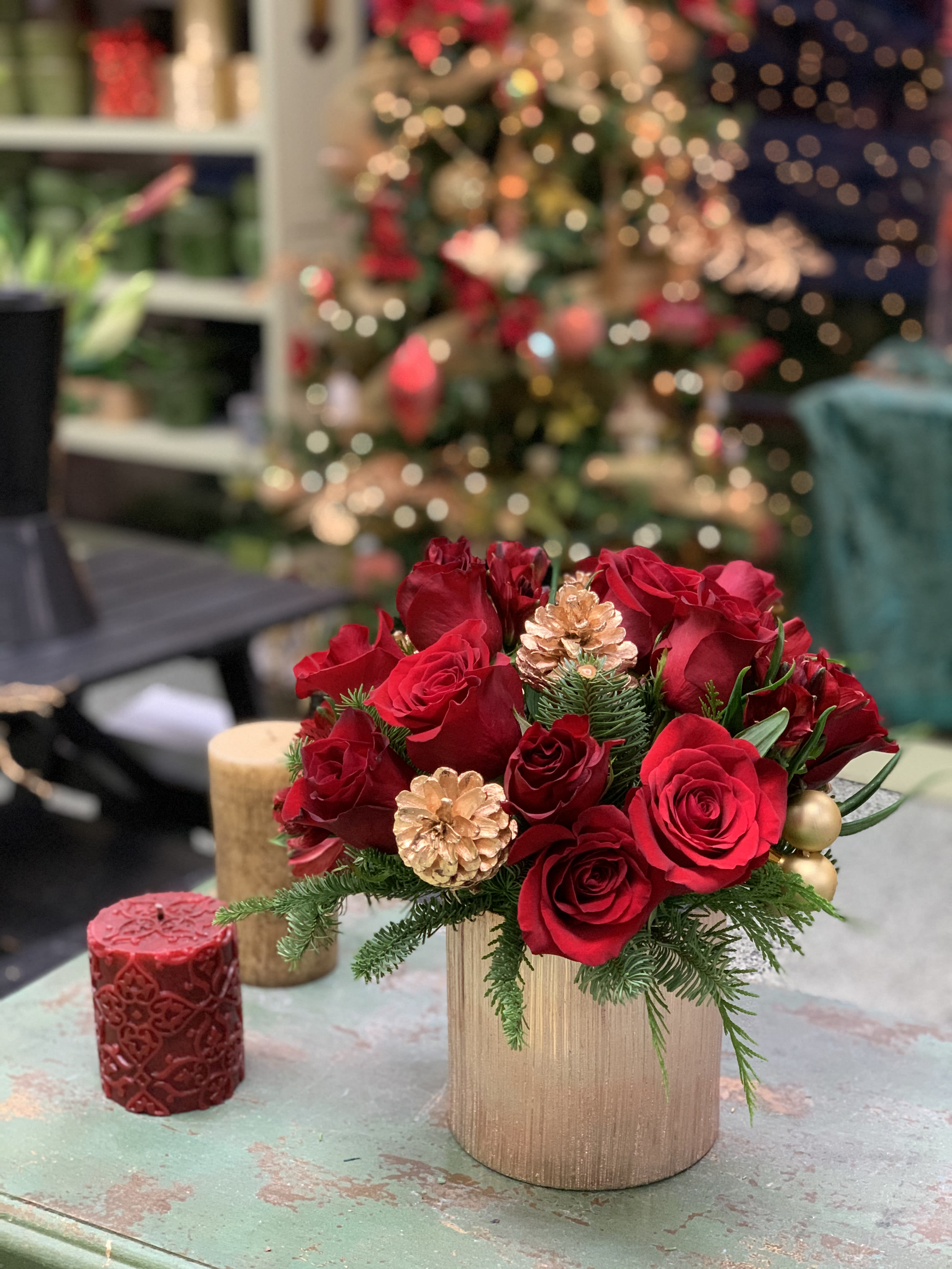 Sweet Hearth - Gorgeous, contemporary take on a dozen roses. 12 premium red roses artfully designed in a gilded ceramic and adorned with holiday sparkle. This brand new arrangement will warm the heart of that special someone.