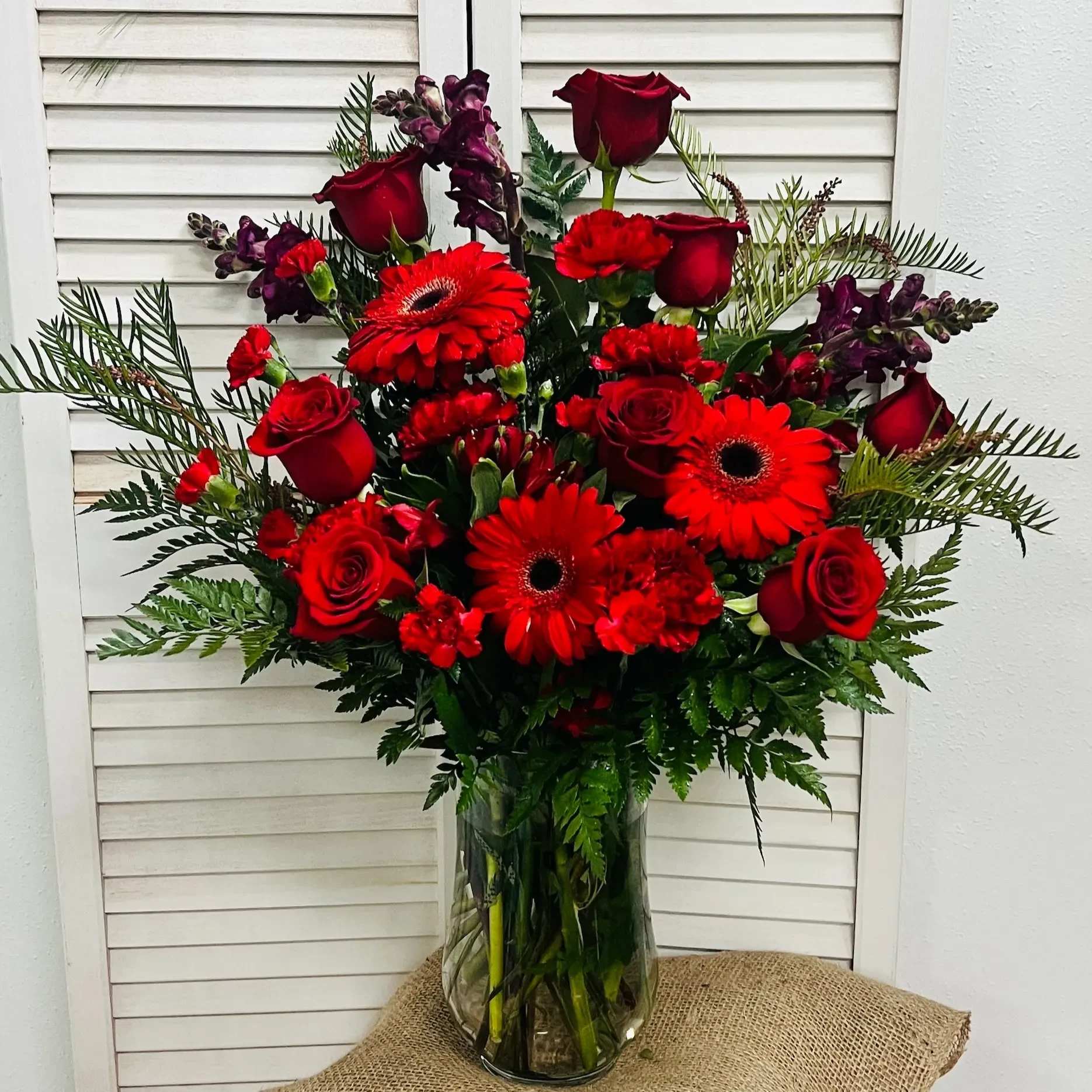 Hearts On Fire - If your love is still the queen of your heart, show them with this regal, awe-inspiring bouquet of roses, snapdragons, alstroemeria, daisies, tulips, and more!