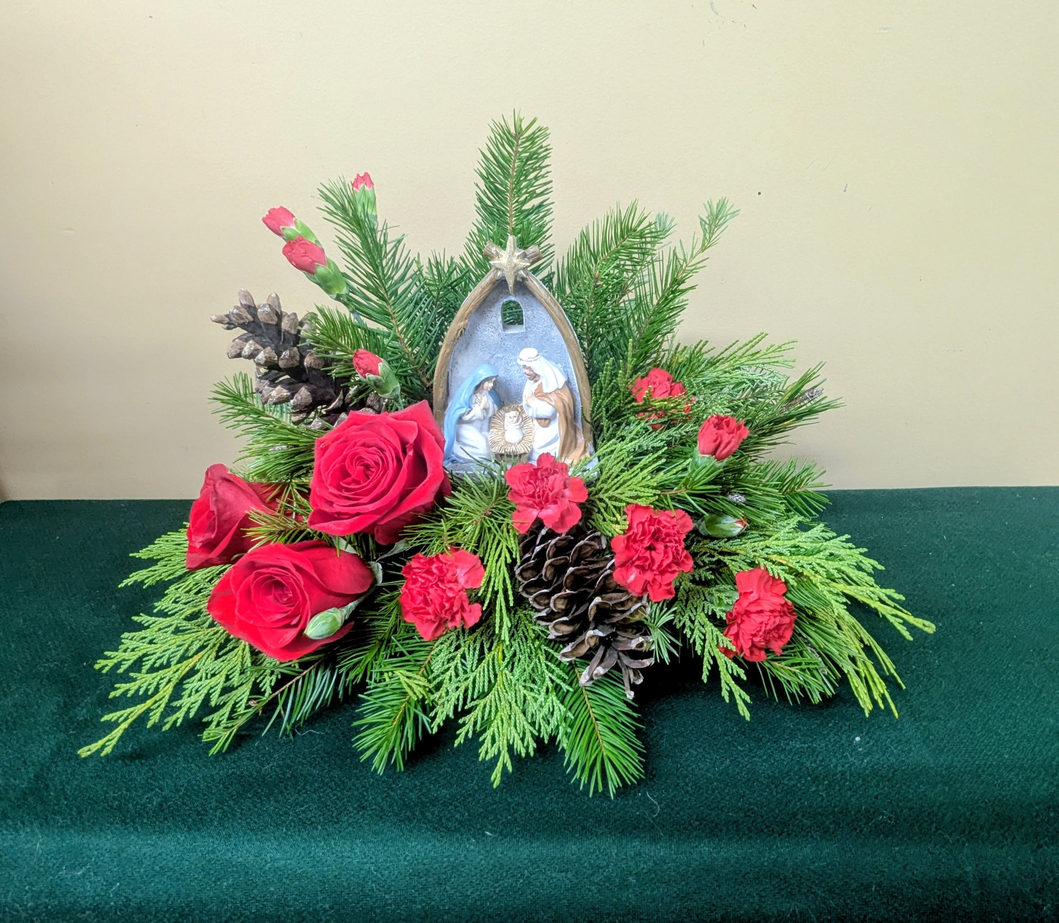 Silent Night, Holy Night - Love came down that Silent, Holy Christmas Night A wonderful nativity keepsake sat among lush Christmas Greenery, Red Roses and Red Carnations. 