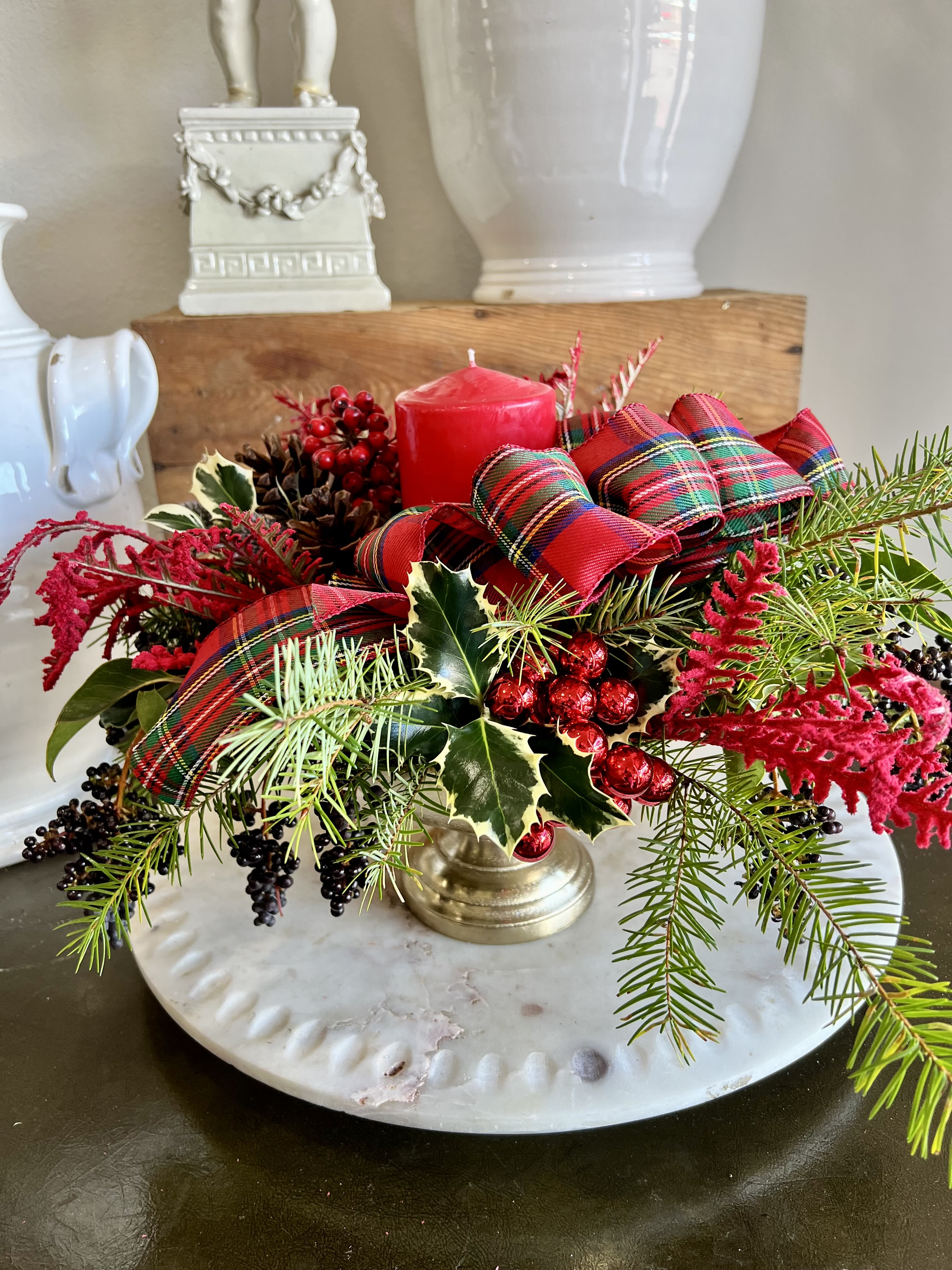 Arrangement for the Season  - A long lasting arrangement with Christmas greens, berrys, holly, and a candle. Perfect for your dinning room table. 