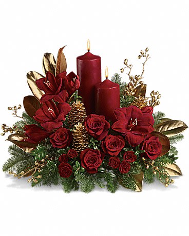 Candlelit Christmas  - A striking seasonal statement for the dining table, hallway or entryway, this gorgeous arrangement is a festive mix of reds, golds and greens with two dramatic pillar candles for a warm glow.