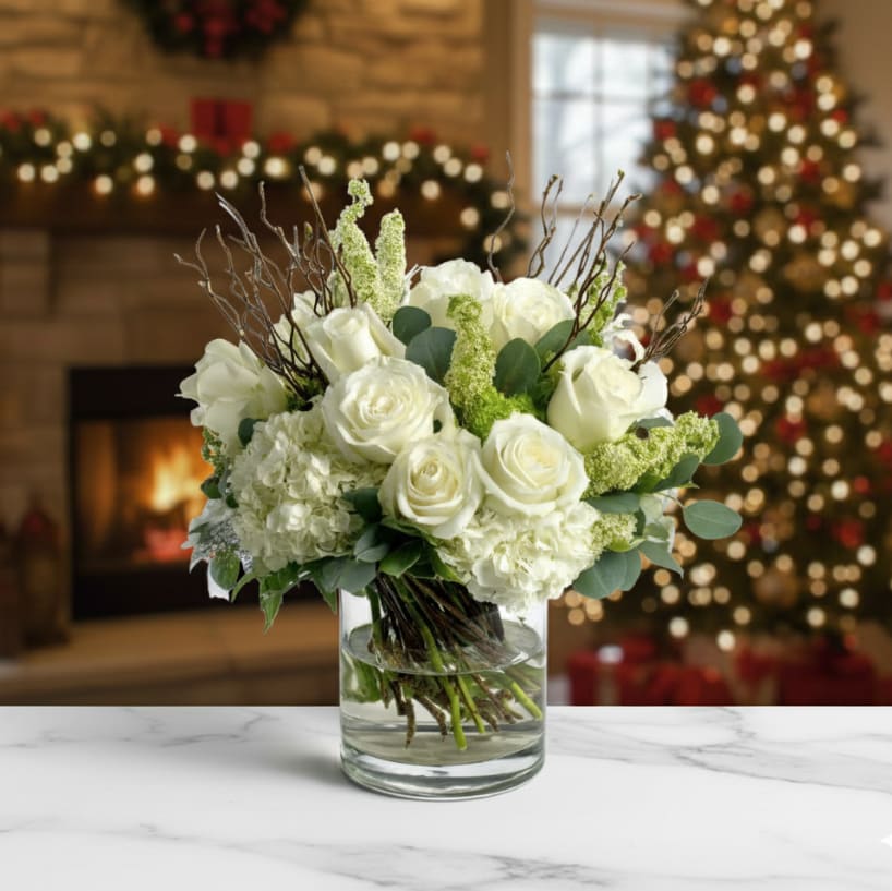 Snowy Serenade - Like fresh snow on a quiet morning, this arrangement is a peaceful blend of ivory blooms and natural branches for an elevated winter feel.