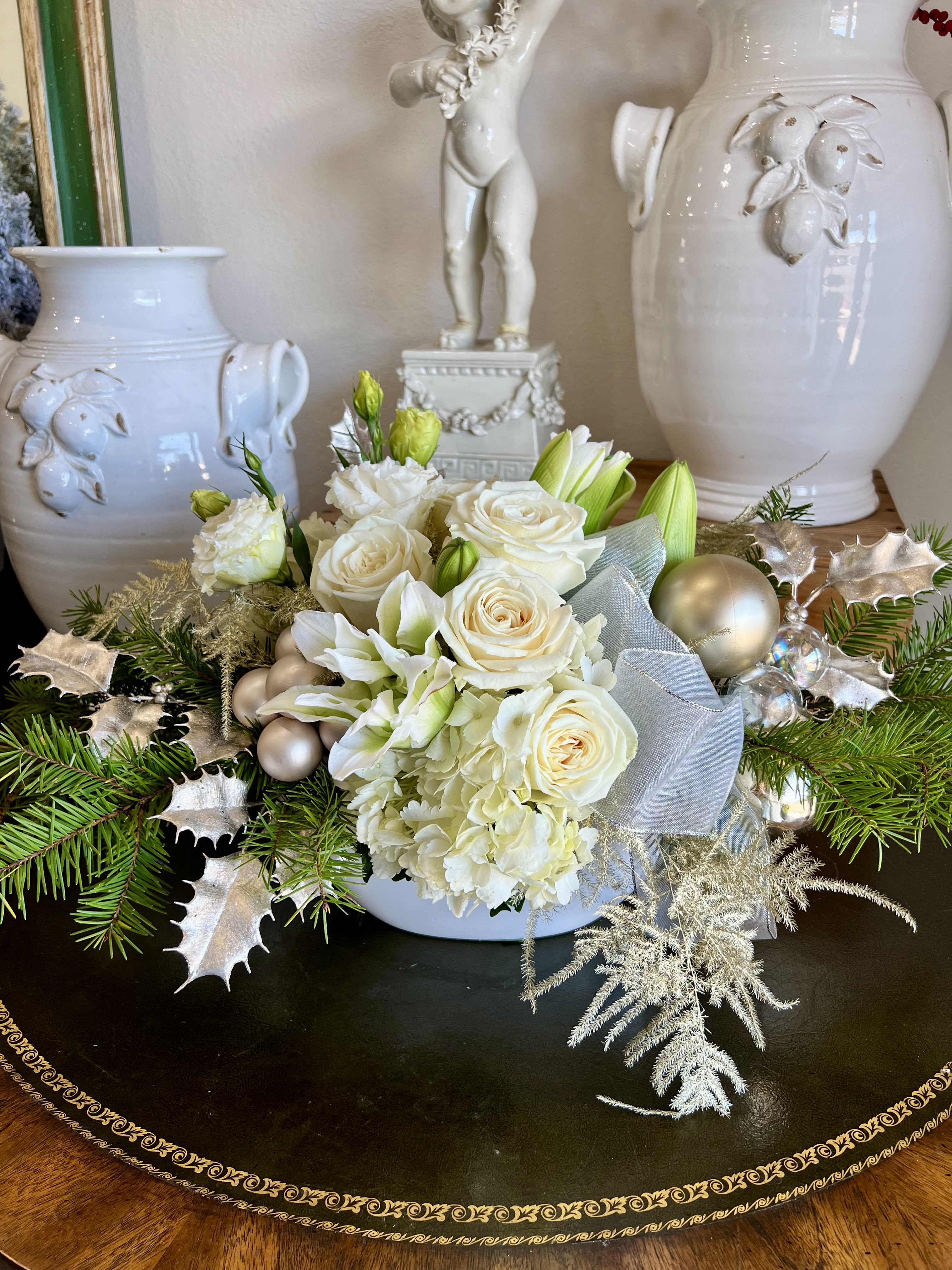 Elegant White Christmas - An array of white flowers and golden silver accents. 