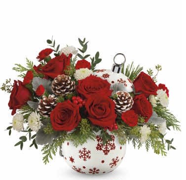 Teleflora's Sprinkle Sparkle Bouquet - Brighten your Christmas with a bouquet of vibrant red roses and winter greens, beautifully arranged in a hand-painted ceramic ornament jar with sparkling stars. It's perfect for holding wrapped candies and holiday treats afterward!