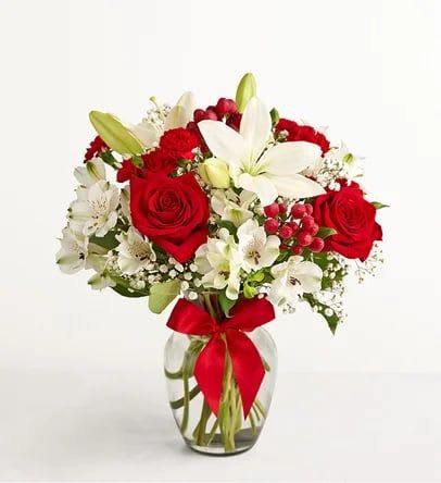 ChristmasMagic - This beautiful bouquet comes with Red Roses, White lillies, and alstroemerias. This bouquet is available year round, and is perfect for every occasion regardless of how cold the weather is. Gift the Christmas Magic to your favorite person to make them feel the christmas holiday!