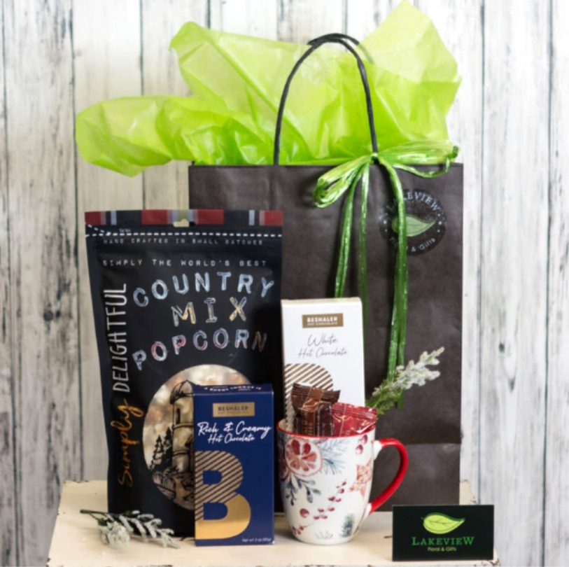 Cocoa - A hot chocolate gift basket perfect for the cold winter days! Enjoy a festive mug and holiday treats while watching the snow fall outside!  Approximate Dimensions: 13&quot;H x 8&quot;W