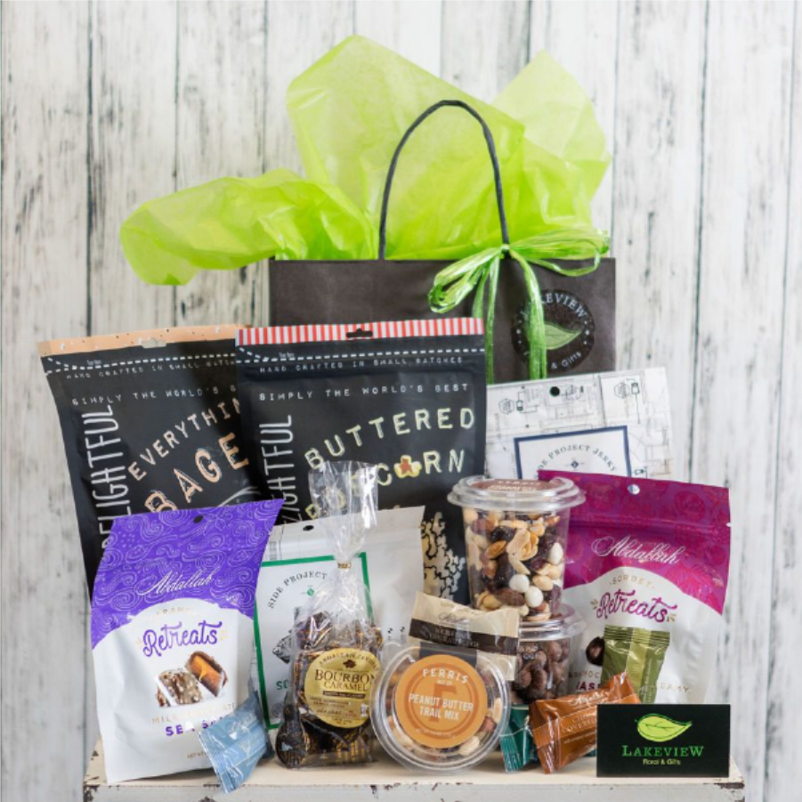 Yum! - Great for the whole gang (or just 1 super special someone!) a snack basket contains an assortment of gourmet popcorn, locally made chocolates, jerky, assorted trail mixes and nuts.  Our team chooses specially selected treats to complete this gift!
