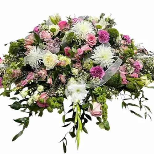 Soft Thoughts - Garden inspired casket spray of all white and soft pink flowers.