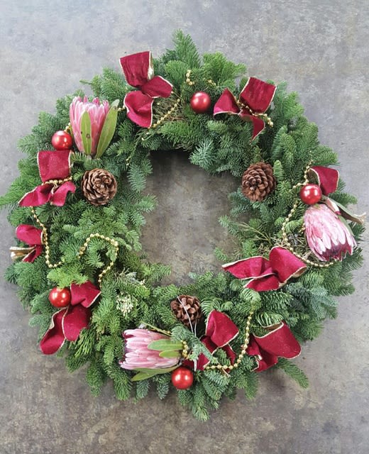 Wreath of Beauty - Select this beautiful wreath filled with protea, and burgundy gold accents on a 24&quot; Christmas Wreath.