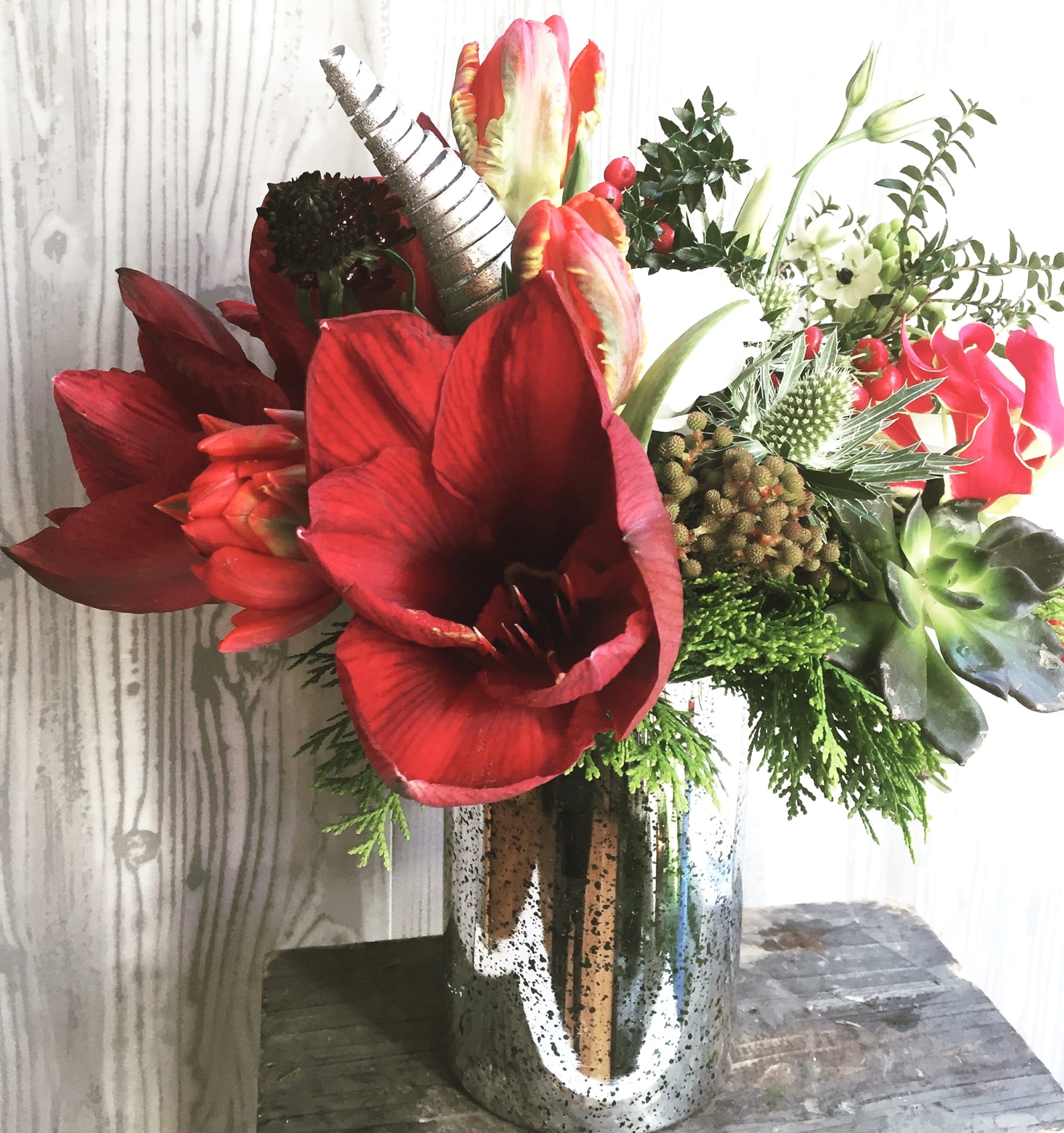 Red Charm - Holiday blooms with ornament. Perfect gift to send for the holidays.Send the best flowers from the best flower shop in New York. We offer same day flower delivery in Manhattan, Queens, Bronx, Brooklyn, Staten Island and West Chester counties. We have the prettiest and most luxurious flowers to choose from and our designs are unique and whimsical. We carry Peonies almost every day of the year!!