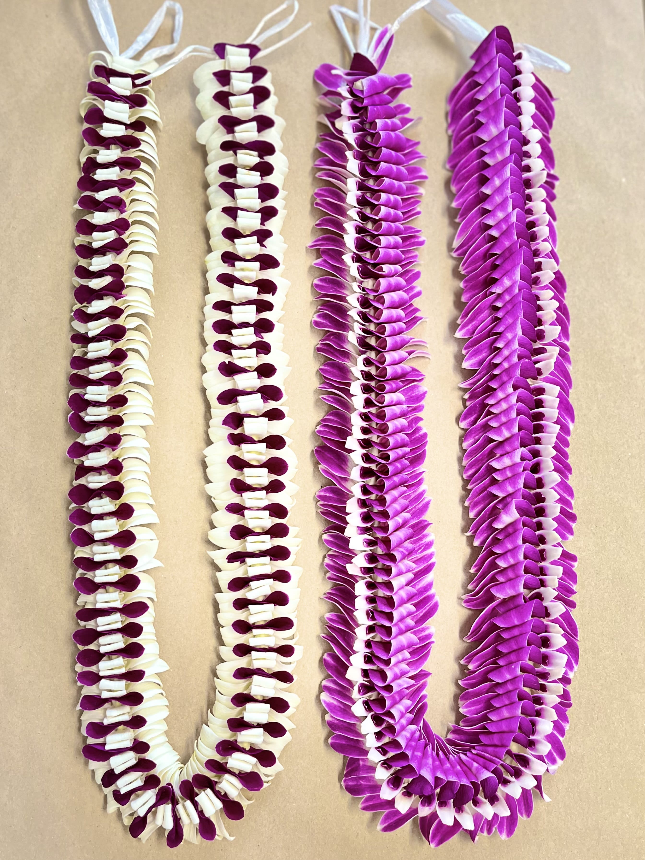 BUTTERFLY ORCHID LEI.  Let us choose the best color for you - Colors and lei types VARY. due to season &amp; availability   Order quickly   Limited supply each week  1- BUTTERFLY SPECIALTY LEI: LAVENDER/PURPLE OR PURPLE With WHITE or LAVENDER/GREEN     (Only one lei per order)
