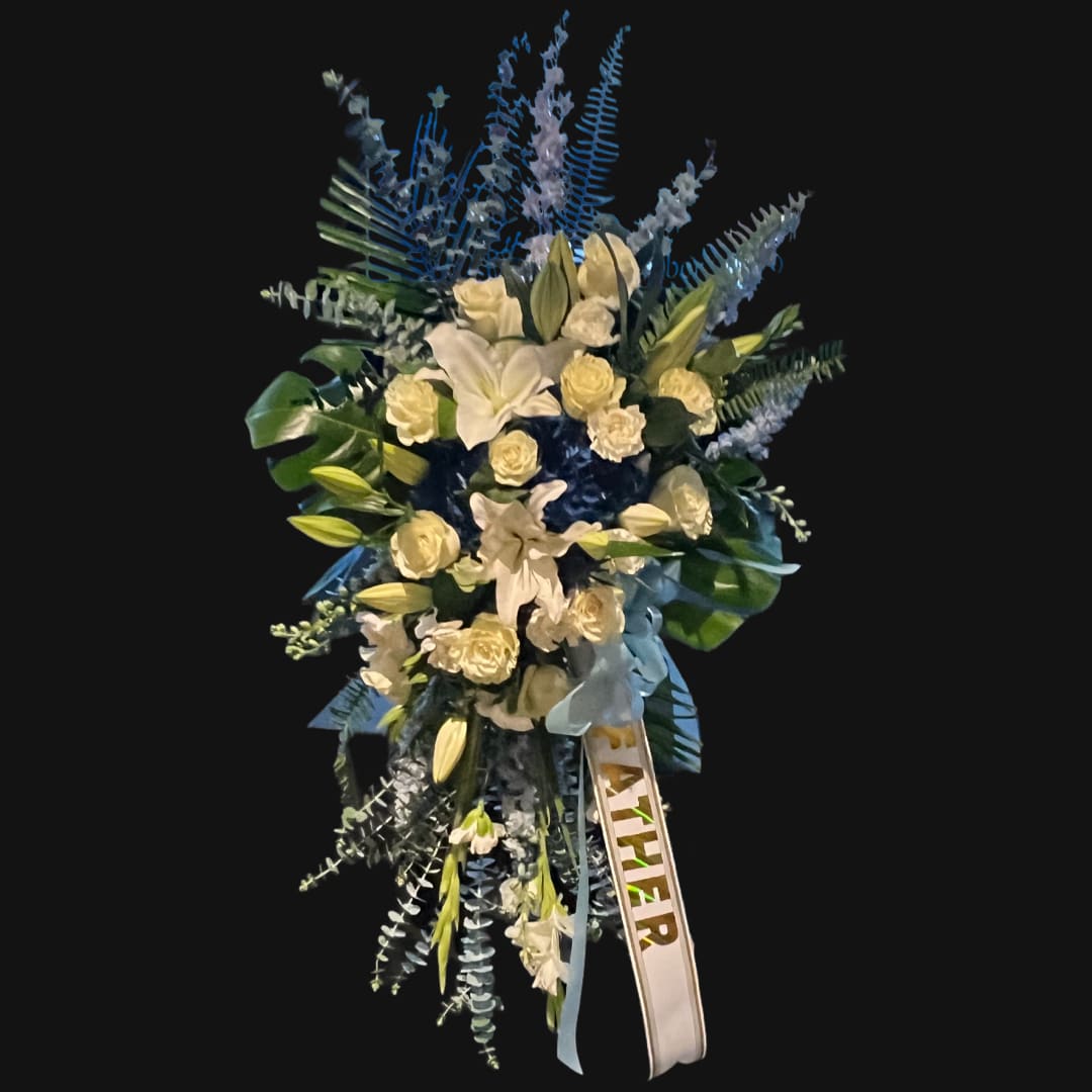 Serene Standing Spray Blue &amp; White - Helping someone find peace after the loss of a loved one can be difficult. If you want to offer your condolences through flowers, our timeless standing spray in blue and white is a beautiful choice. Shown in Premium Size