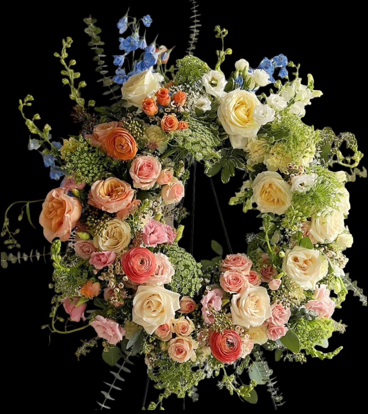 Treasured Tribute Wreath - Treasured Tribute Wreath offers peaceful wishes of heartfelt sympathy with each delicate bloom. Beautifully arranged to form an elegant accented with lush and vibrant greens. Displayed on a wire easel this gorgeous tribute is a wonderful symbol of eternal life and sweet serenity. Approximately 22 inches in diameter.