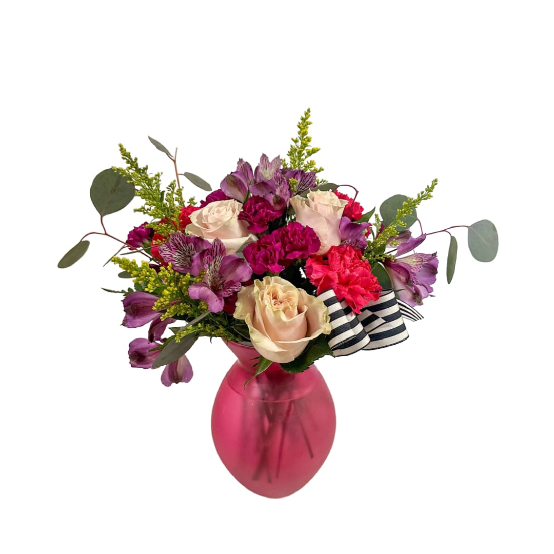 Cheryl  - The Cheryl is full of bright blooms! Roses and carnations.  Vase style and color may vary.