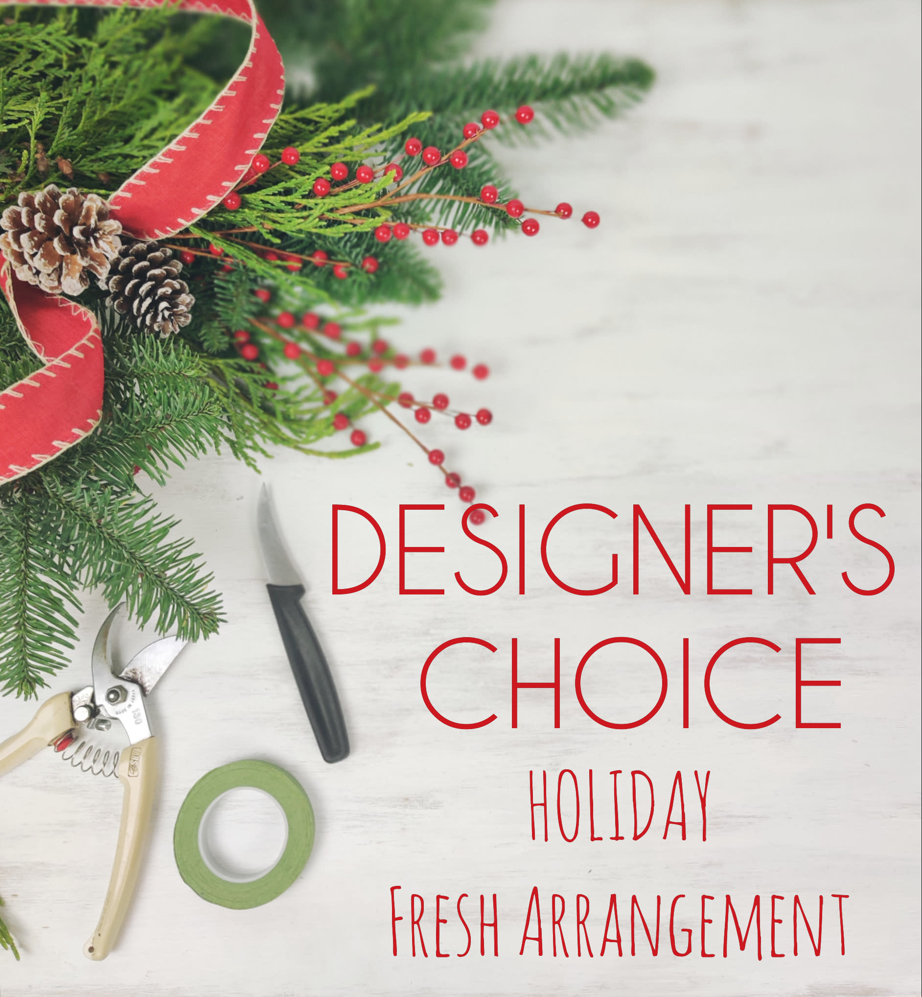 Designer's Choice Holiday - Let our designer's create a beautiful holiday fresh arrangement. Hand selected from our daily fresh flower selection along with Christmas greenery and Christmas deco. This arrangement does come in a container. This arrangement is mostly Christmas foliage and hardgoods (like ribbon, pinecones, berries etc) with a small touch of flowers. ***If  you are looking for more flowers, please see our PREMIUM Designer's Choice Holiday Arrangement version