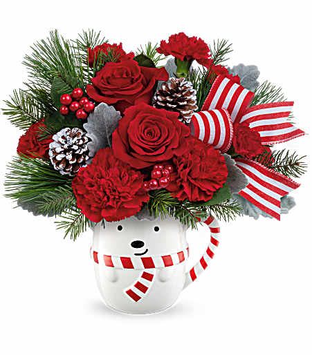 Teleflora's Send a Hug Beary Wish Bouquet - Teleflora's Send A Hug® Beary Wish Bouquet is brimming with red roses, festive greens, and holiday cheer! Arranged in Teleflora's adorable bear mug, it's the perfect way to send warm wishes and smiles this Christmas. Standard size approximately 11 1/2" W x 11 1/2" H.