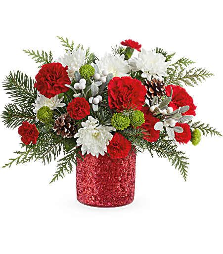 Teleflora's Christmas Magic Bouquet - Teleflora's Christmas Magic Bouquet sparkles with red and green blooms, festive evergreens, and pinecones. Arranged in Teleflora's glittering Magical Wish Vase, it's a cheerful gift for celebrating the holiday season. Standard size approximately 16" W x 12" H.