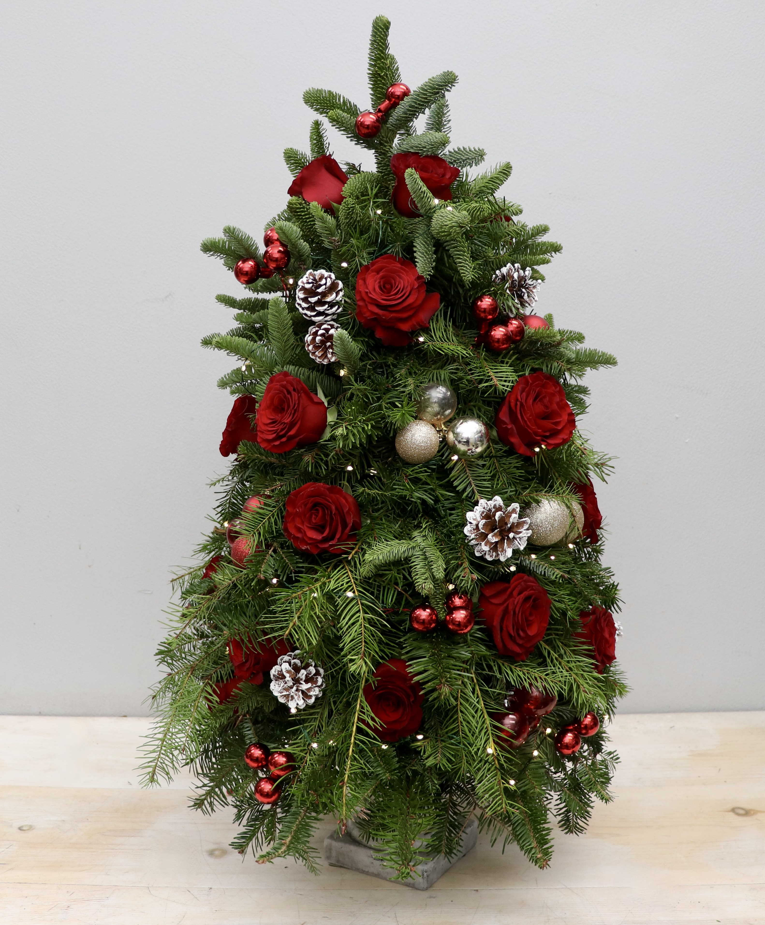 Holiday Harvest Tree - My Glendale Florist -  This beautiful tree mixes roses with Christmas holiday decore and stands at approximately 2ft tall. 