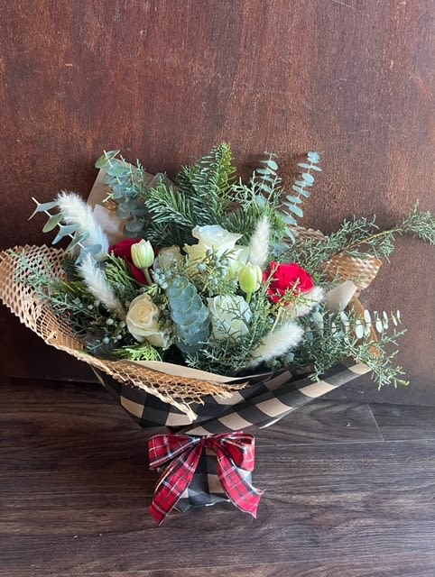 Bundle Up Bouquet - Warm up the season with a stunning winter bouquet that features an enchanting mix of winter greens, white pampas and vibrant pops of red and white flowers.  Let this exquisite combo bring warmth to chilly days. 