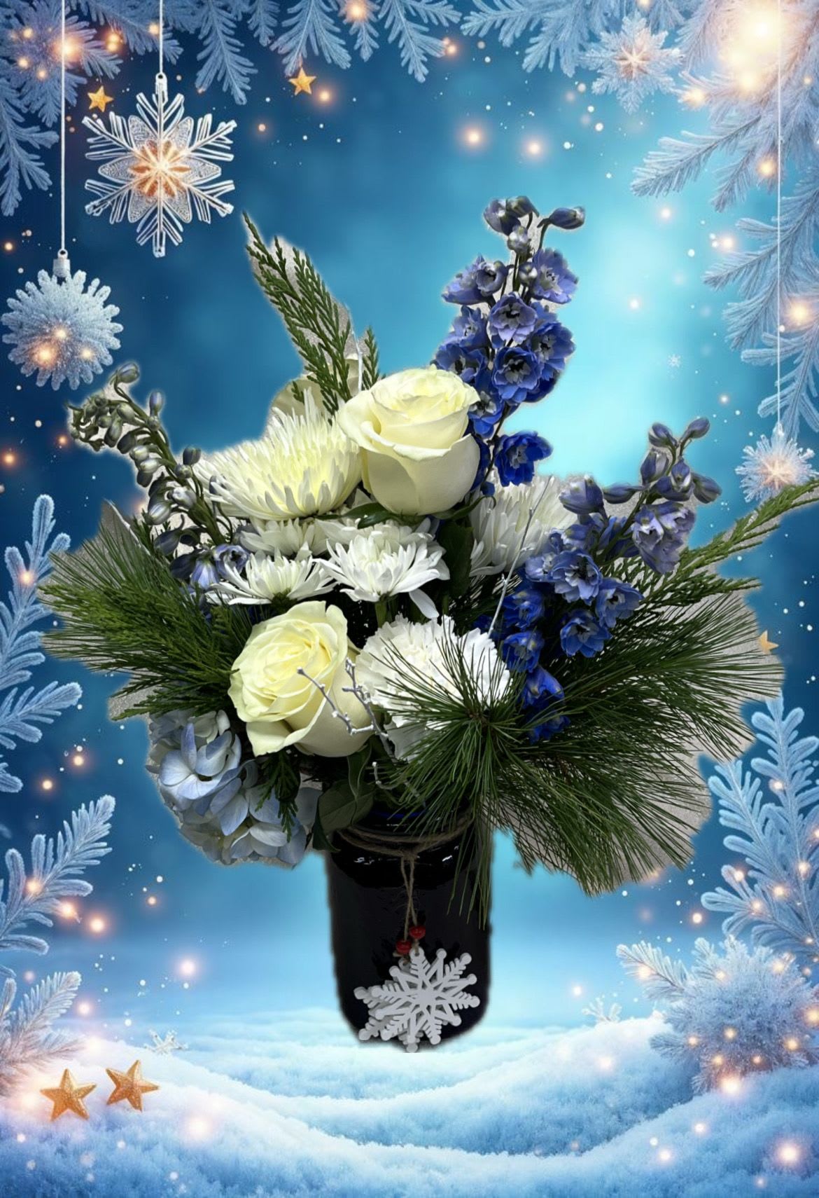 Christmas Flurries - Send this wintry mixed bouquet to someone on a cold winters day. This blue vase consist of flowers in blue and white tones and accented with snowflakes.