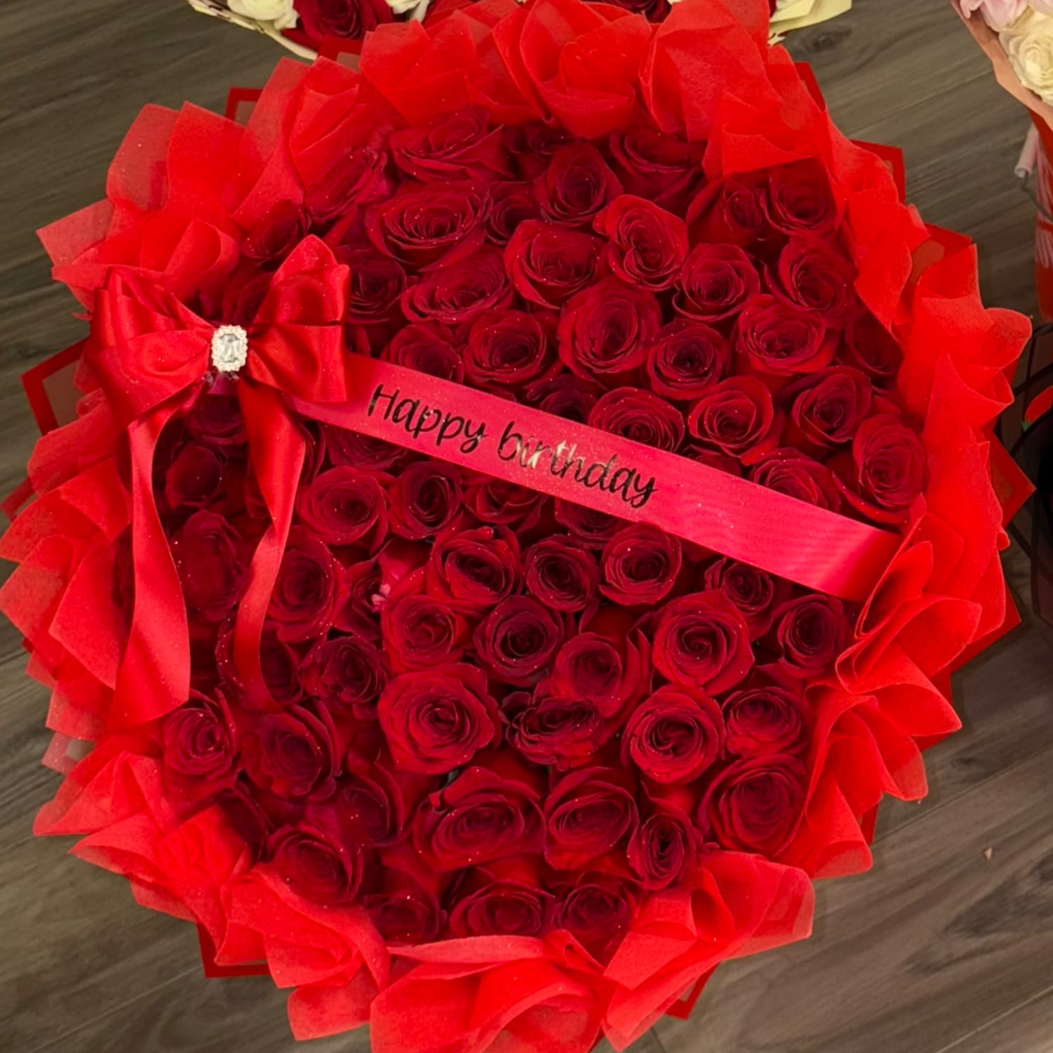 Luxury Red - 75 Count Red Roses , wrapped in red paper &amp; red fluff