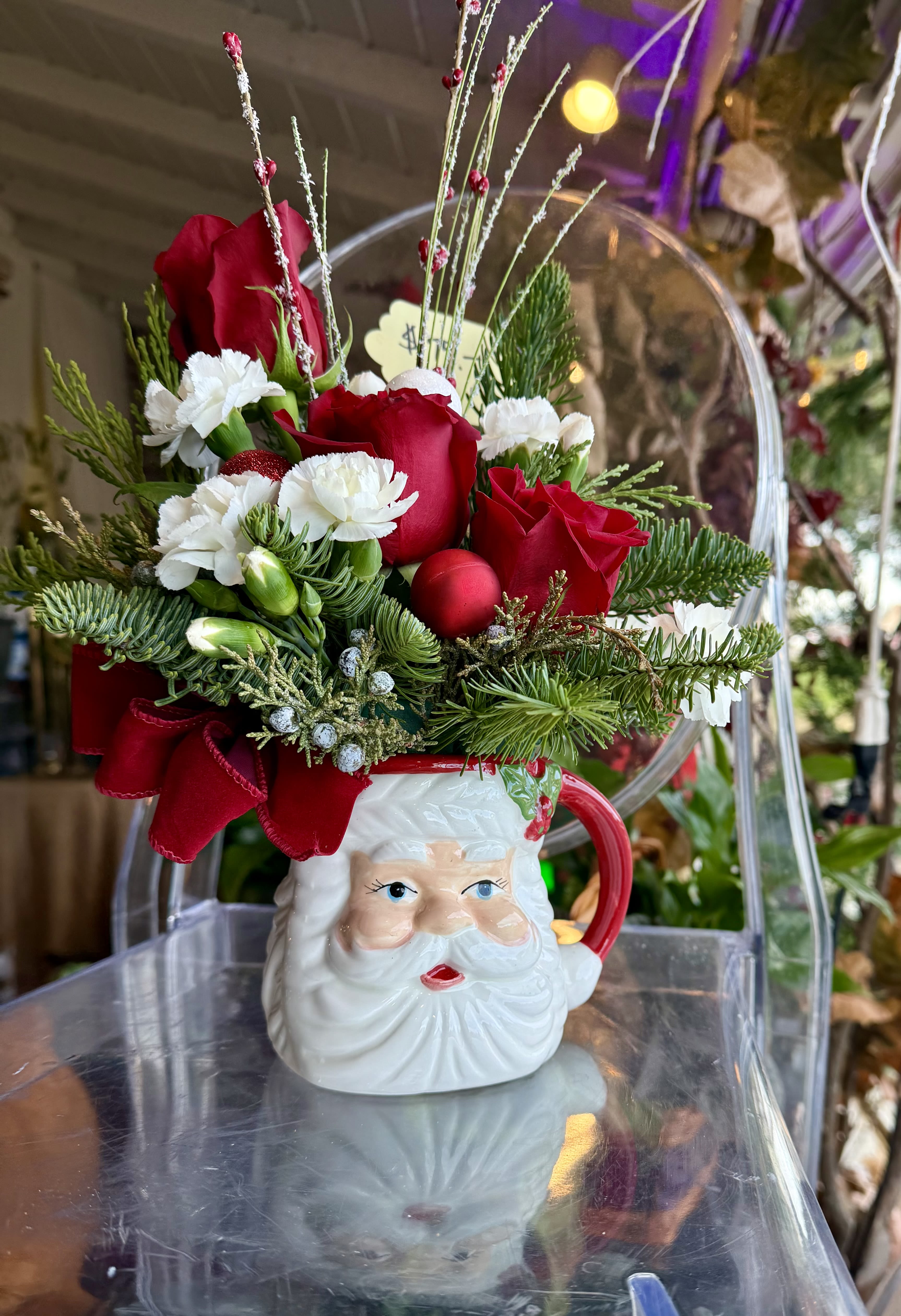  Santa Face Mug By Flower Carriage - A Festive Mug of Santa's face, Red roses, mini carnations, pines greenery, ornaments and ribbon. Perfect gift for Grandparents, coffee mug for all.
