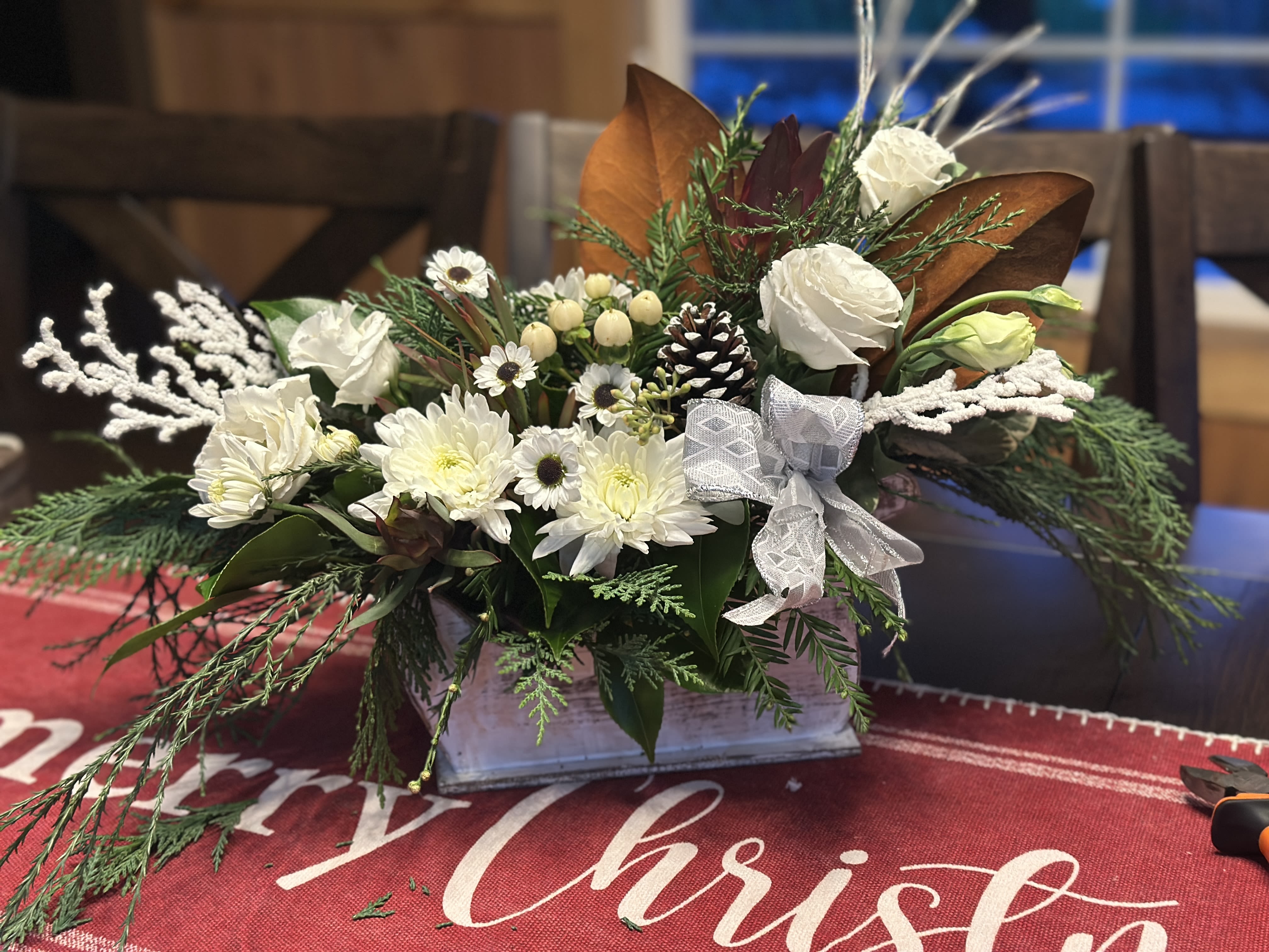 Sleigh Bells Ring - Pure white flowers in this rustic wood sleigh. All white seasonal flowers with winter accents and berries . Add a note if you want a touch of festive red 